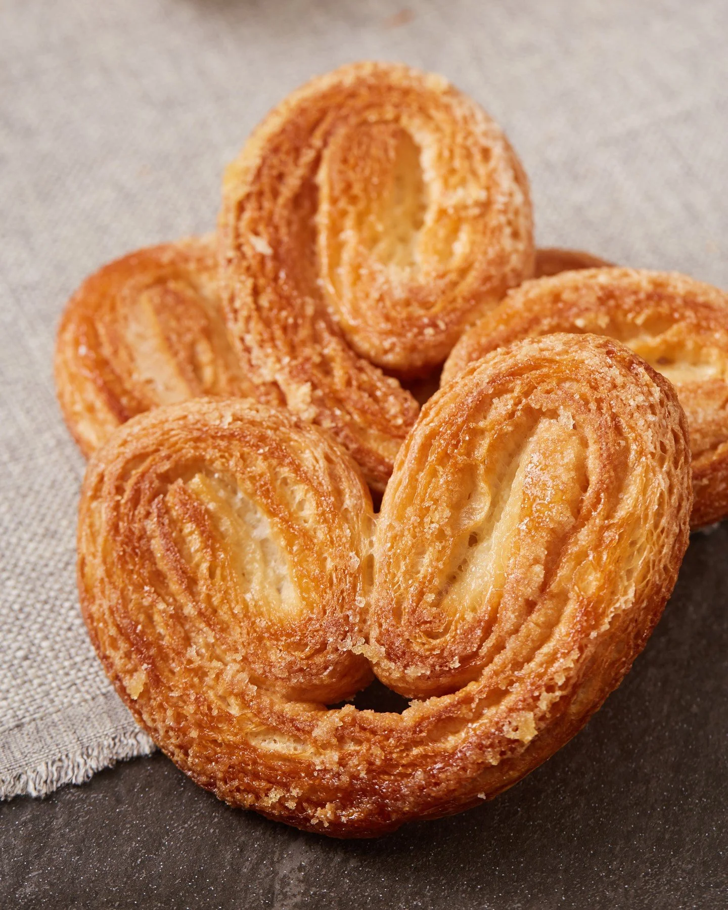 Layers of buttery puff pastry, baked to golden perfection with spiced sugar. Our Cinnamon-Sugar Palmier is a simple pleasure done right.