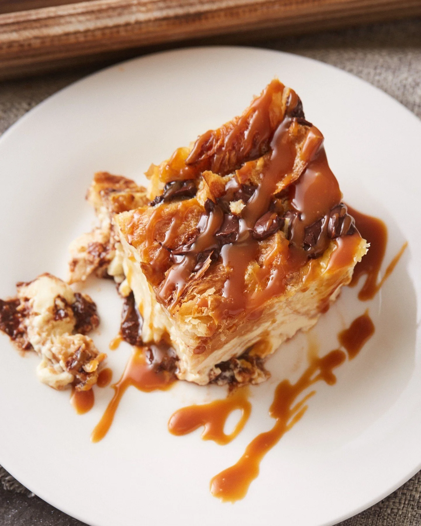 There's nothing like a slice of our Chocolate Croissant Bread Pudding right out of the oven. Rich dark chocolate, buttery croissant, and velvety salted caramel sauce make it the perfect pairing for a cozy night in. 

Available in-store or for pre-ord