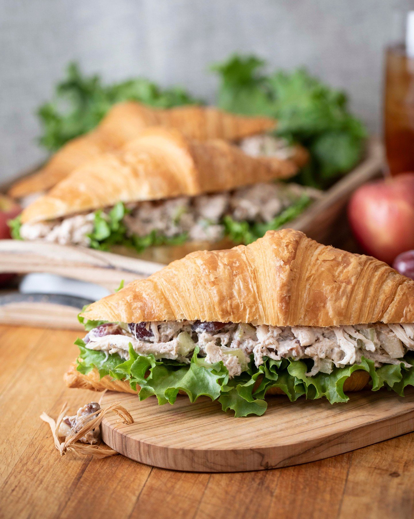 It's a staple sandwich for a reason... Our Chicken Salad Croissant hits a perfect balance: tender oven-roasted chicken, crisp celery, juicy red grapes, tart green apple, and crunchy walnuts, all piled high on our fresh-baked croissant.

Pair it with 
