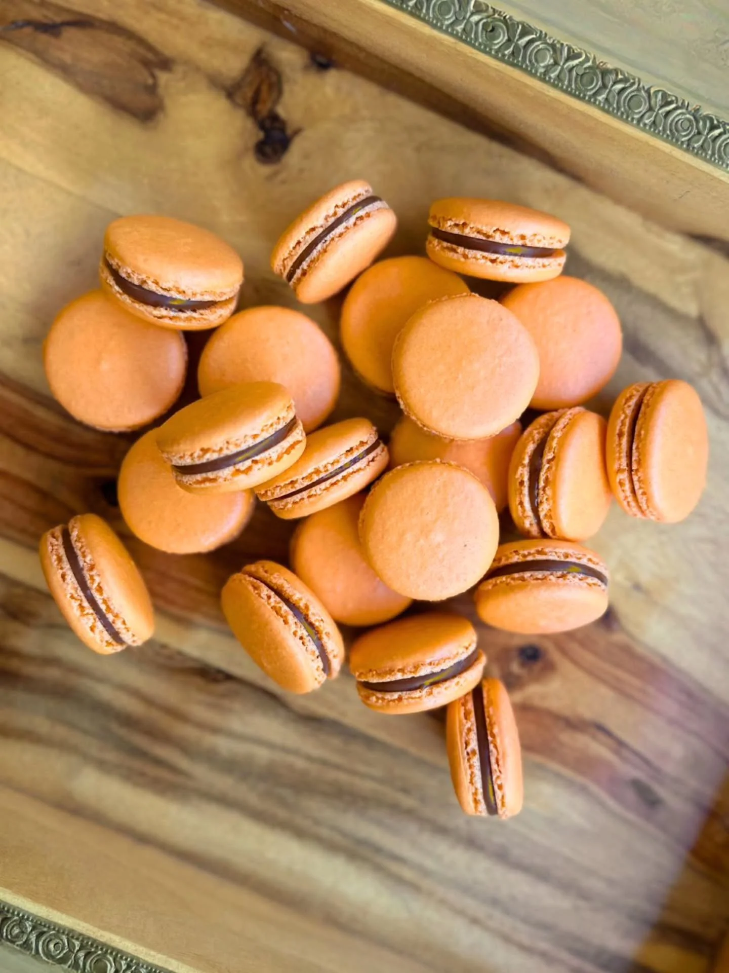 Our Tropical Caramel Macaron is filled with velvety milk chocolate caramel with notes of mango, passion fruit, and vanilla, sandwiched between crispy, delicate macaron shells. 

Stop by and give it a try before it's gone!