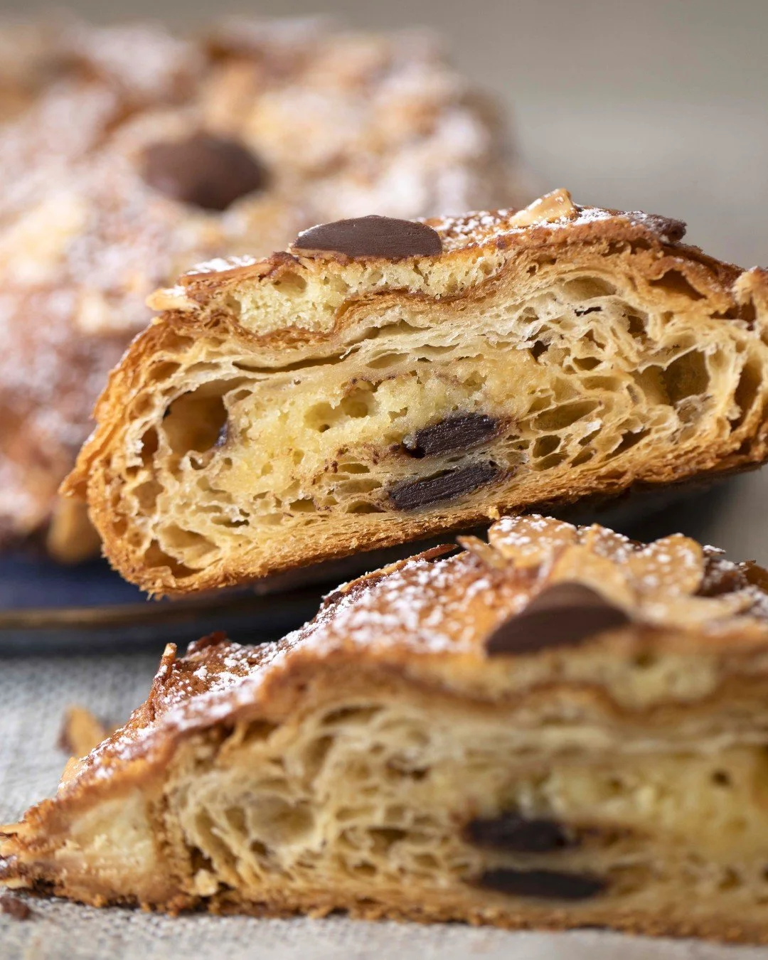 Our Chocolate Almond Croissant starts is filled with rich almond paste and dark chocolate, baked until golden and finished with sliced almonds, a dusting of powdered sugar, and more dark chocolate (for good measure).

One look inside says it all. 🤎