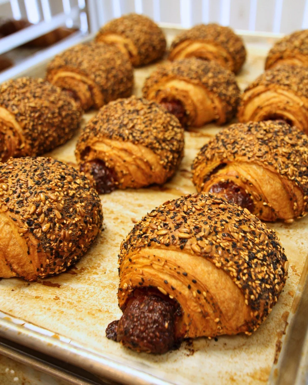 Filled with savory ham, nutty Gruy&egrave;re, bright whole grain mustard, and generously coated with a toasted blend of poppy seeds, white and black sesame seeds, and sunflower seeds&mdash;every bite of our Smoked Ham Gruy&egrave;re Croissant is a bu
