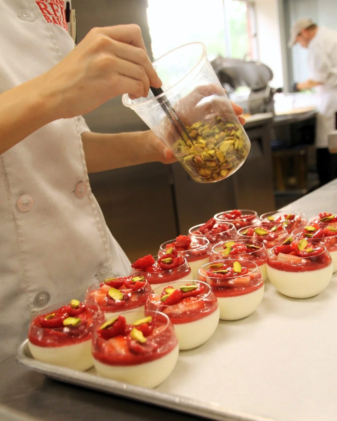 Our Panna Cotta is made with Madagascar vanilla beans, topped with vibrant strawberry&ndash;raspberry confit, and carefully decorated with pistachios and fresh sliced berries.

A dessert that's as beautiful to look at as it is to enjoy.