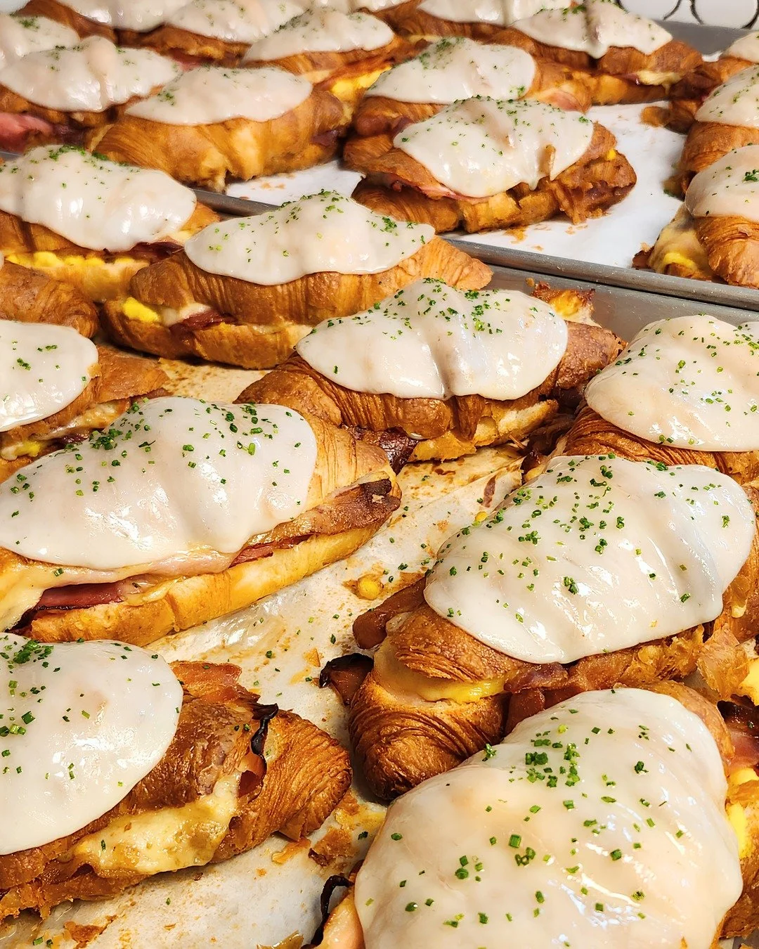 Our Croissant Breakfast Sandwich makes waking up early on the weekend worth it. 🥐

Available only on Saturdays, it has everything you could want in a breakfast sandwich: buttery croissant, crispy bacon, smoked ham, fluffy scrambled egg, and plenty o