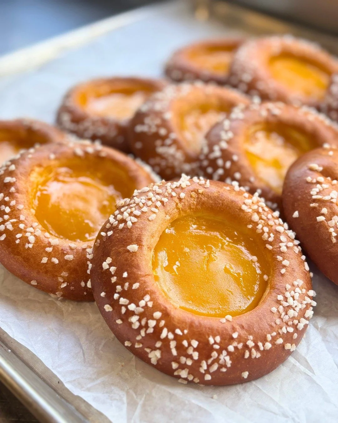 Welcome back our Tropical Brioche! 

This seasonal sweet features fluffy brioche with bright mango-passion fruit cream, sprinkled with crunchy pearl sugar. Available throughout September!