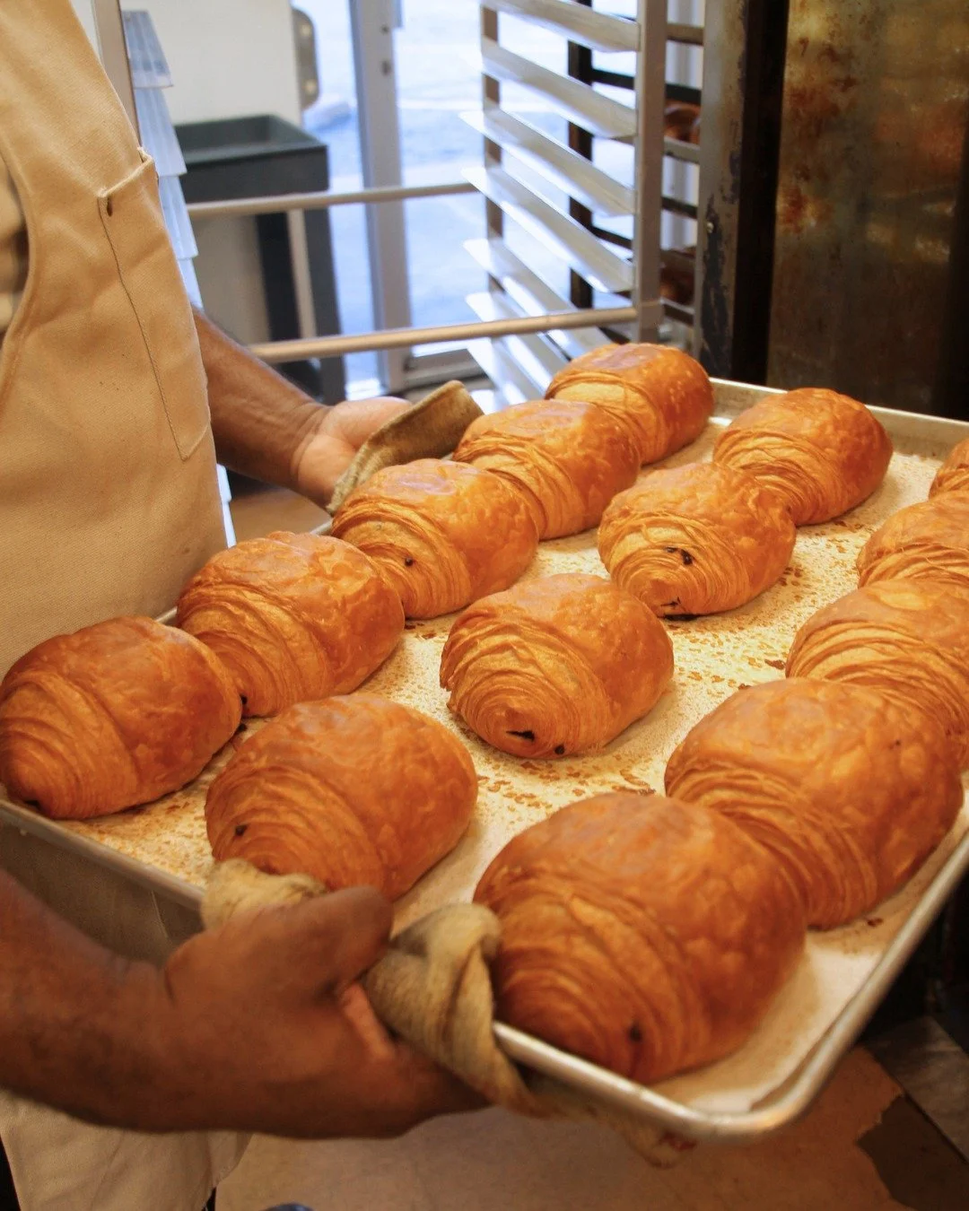 Our tip for getting through hump day? Starting off your day with a freshly baked chocolate croissant and hot cup of coffee.