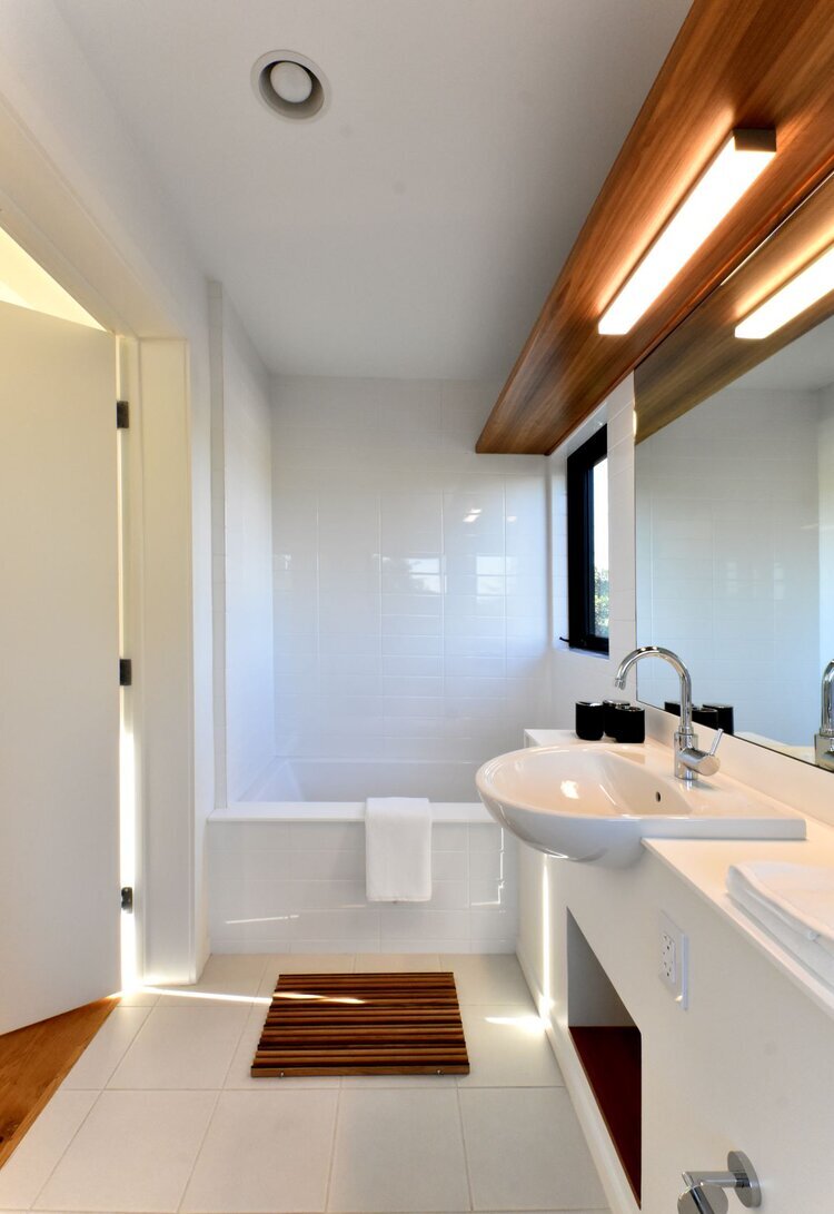 Master bathroom in the Connect Homes model featuring Grenite Recycled Solid Surface prefabricated countertops.