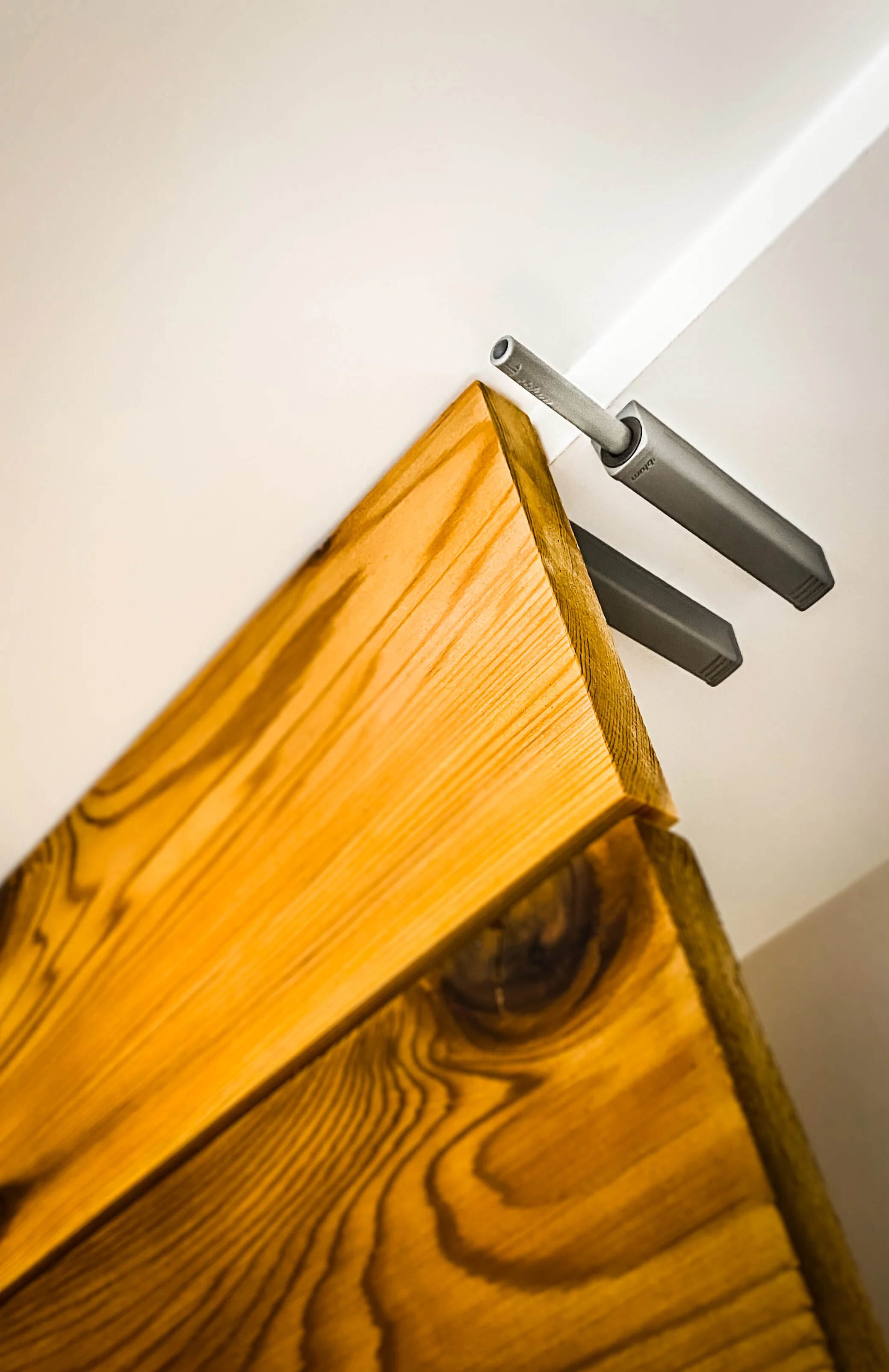 Blum push to open activators for Entryway in Richardson TX by Three Trees Fine Carpentry.JPG