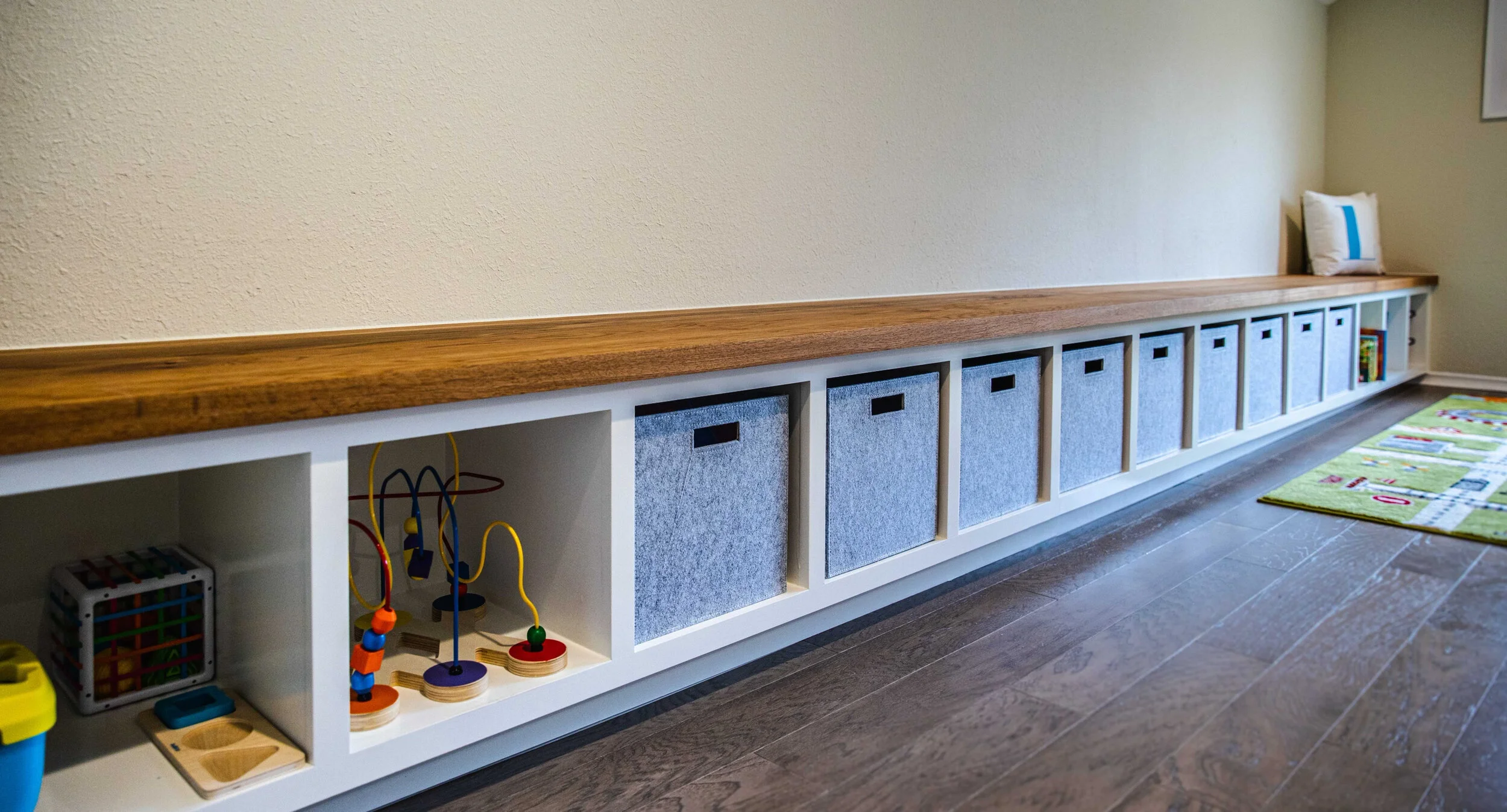 Playroom storae and bench for Media Room at Whte Rock Lake Mid Century Home.jpeg
