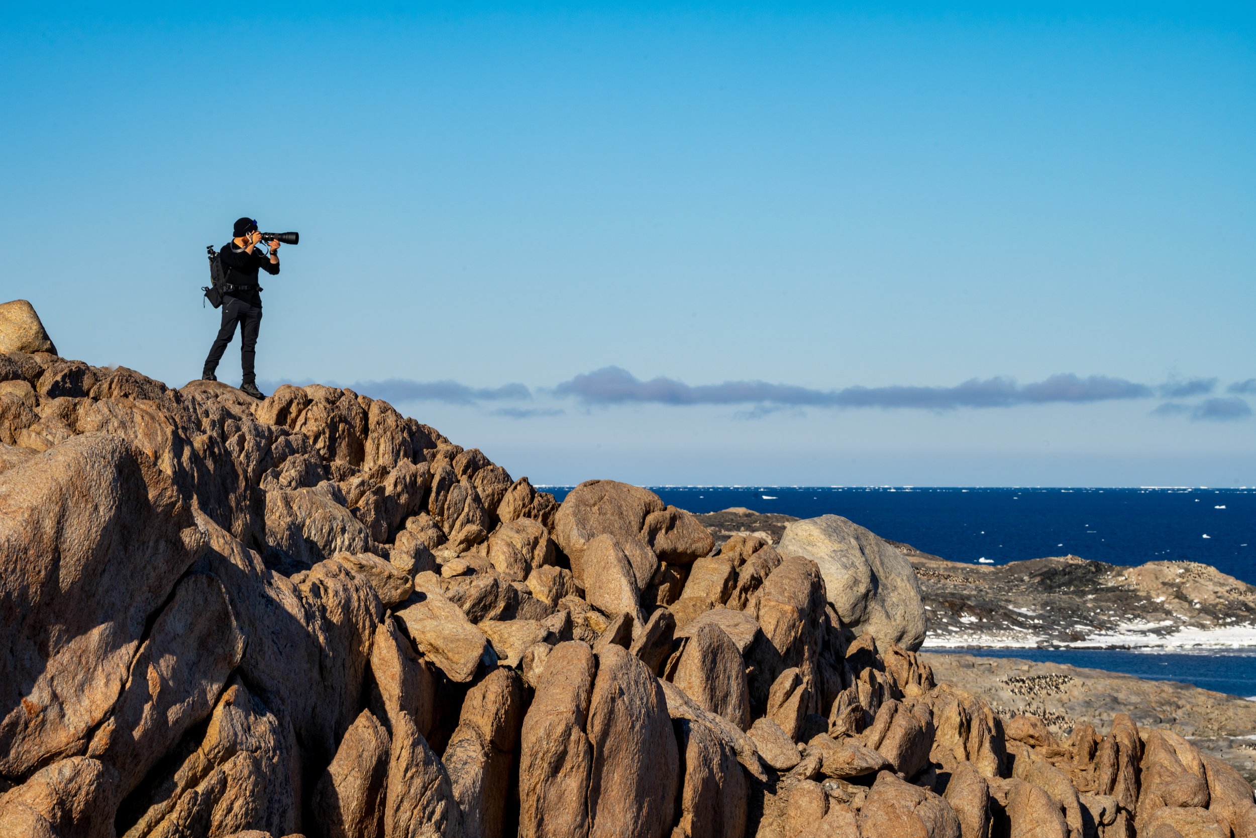 C36 - On Reeve Hill - Harrison taking a photo across Newcomb Bay