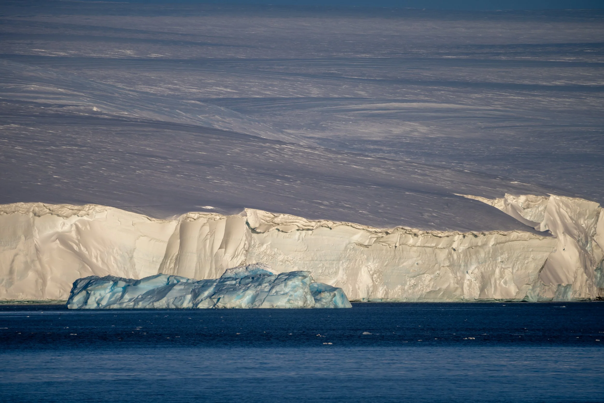 C131 - Taken from Robinson Ridge - Distant blue ice berg provides a sharp contrast to the even more distant ice cliffs of the Ice Plateau