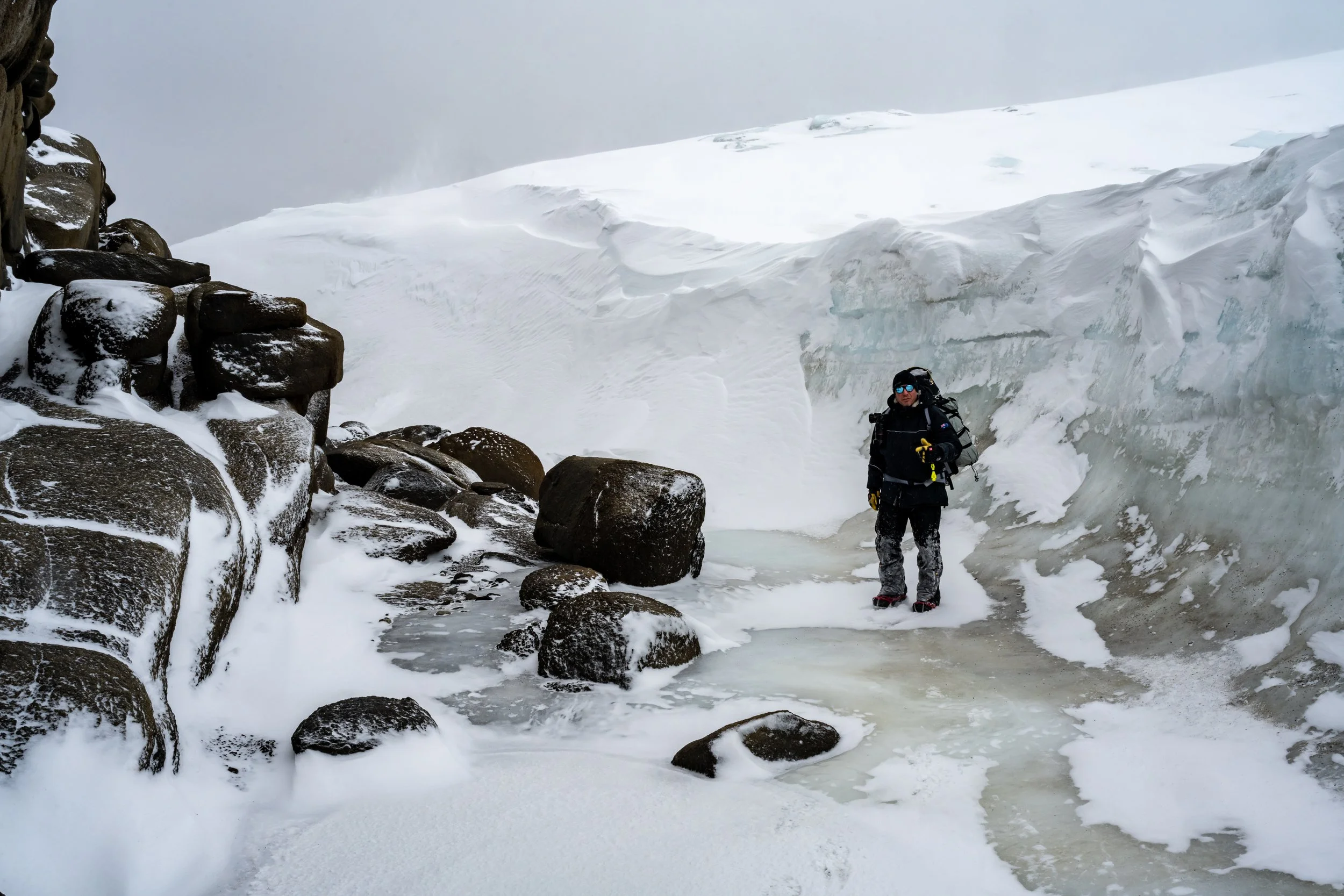 C139 - Justin walking through a wind scour on the Browning Peninsula around 32km south of Casey Station