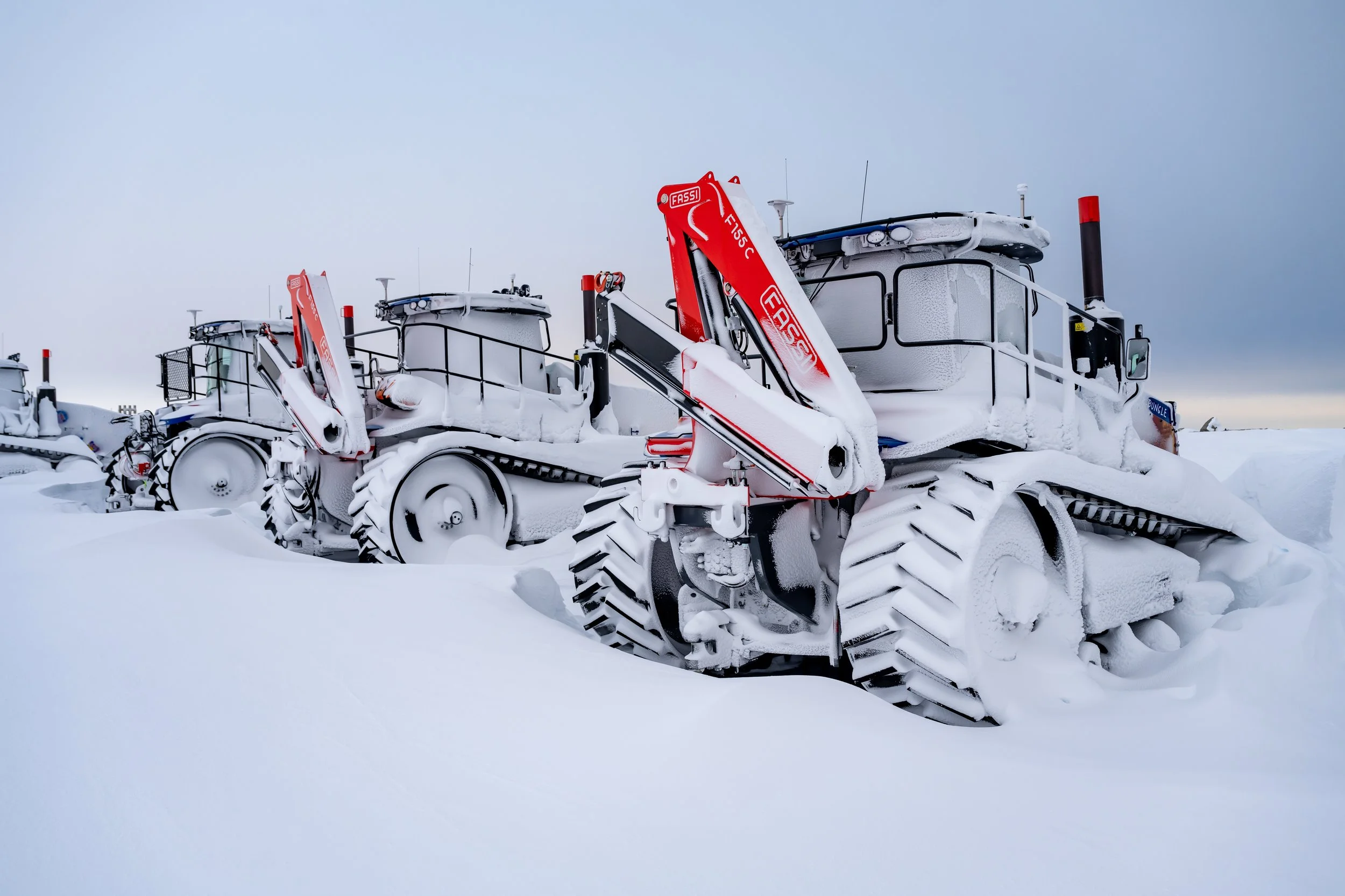 C224 - Three of the brand new tractors for the Million Year Ice Core Project after a snow storm