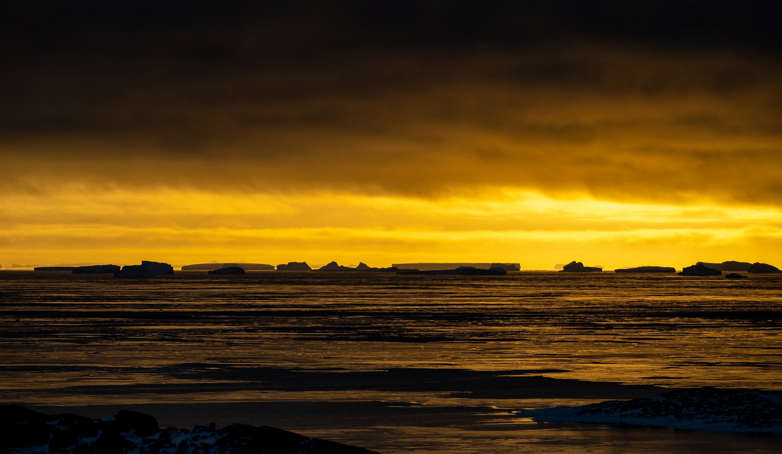 C231 - Sunset over the ice bergs in Newcomb Bay on the 18th of May 2022 at 1:09 pm
