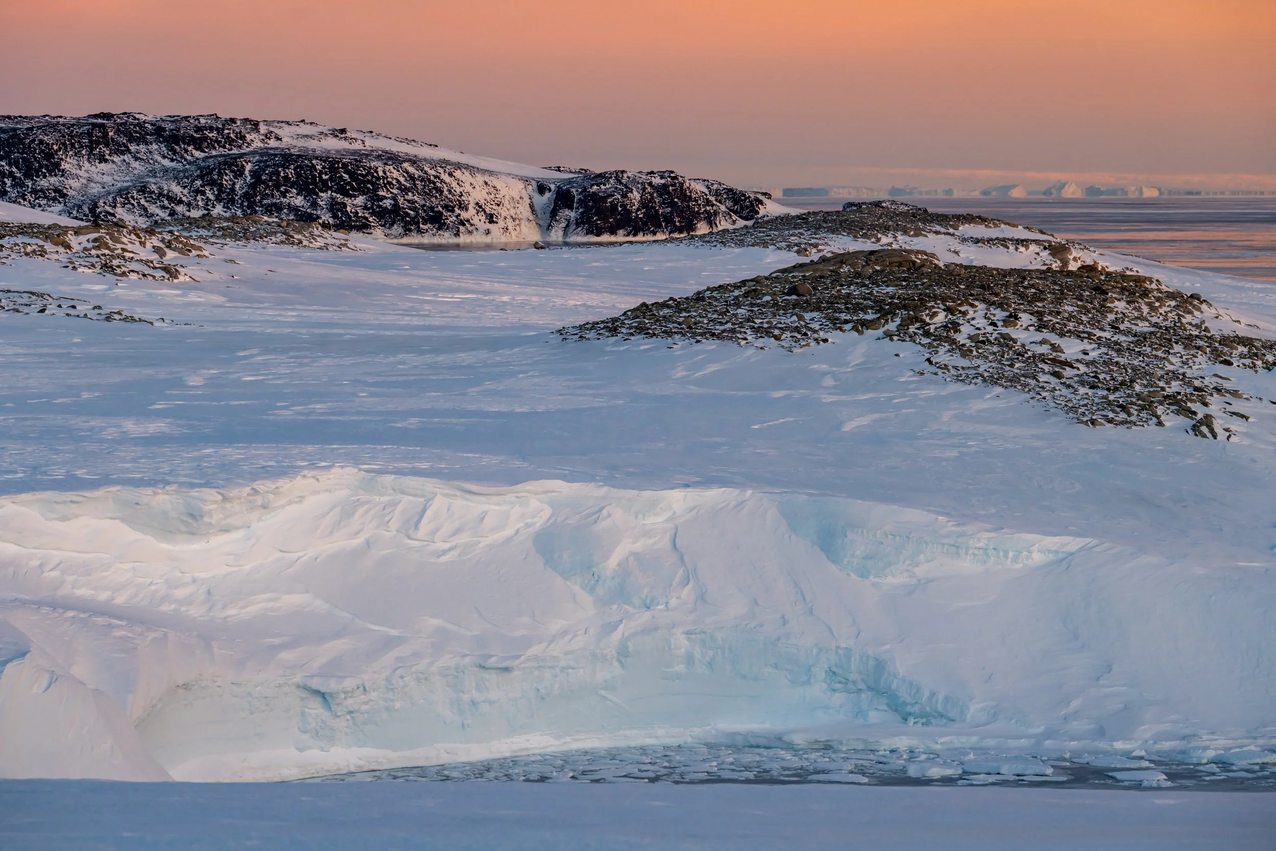C248 - Mitchell peninsula at sunset - view across a small bay with ice cliffs