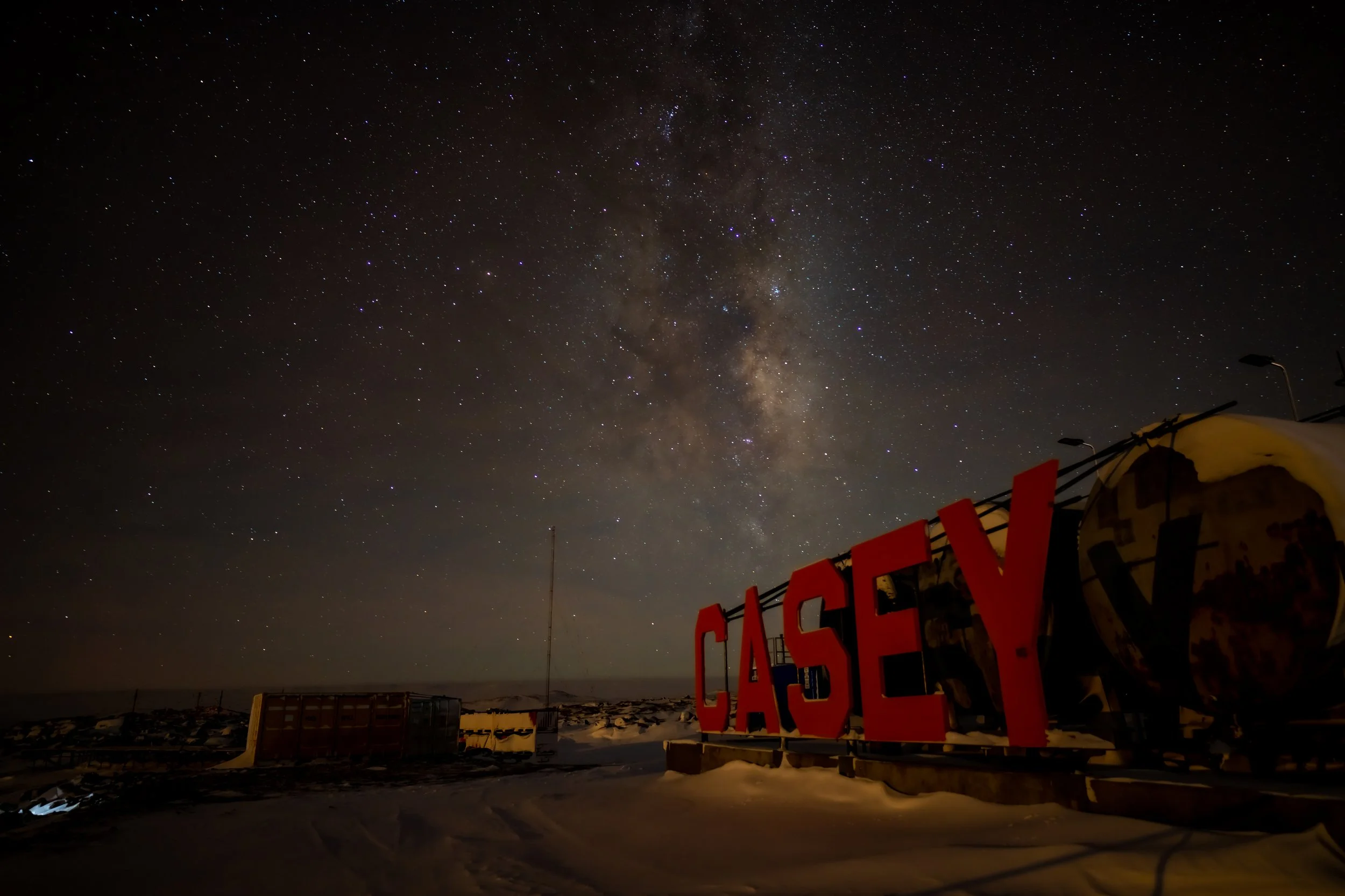 C268 - 9th of May 2022 8:58 pm - Milky Way over the Casey sign next to the fuel farm at Casey wharf