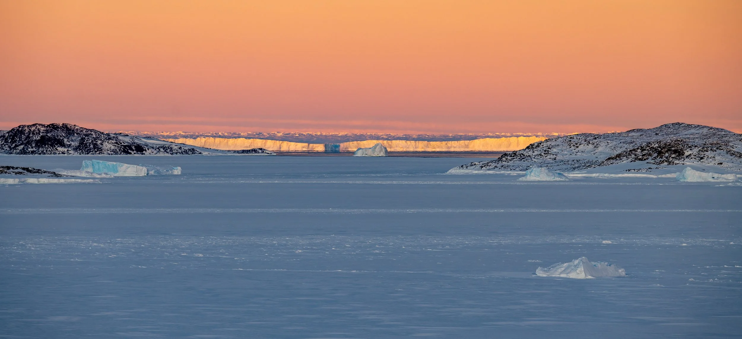 C291 - 8th of May 2022 9:35 am - the pastel colours of sunrise over Ford Island on the right and and the distant Browning Peninsula on the left through to the Vanderford Glacier 