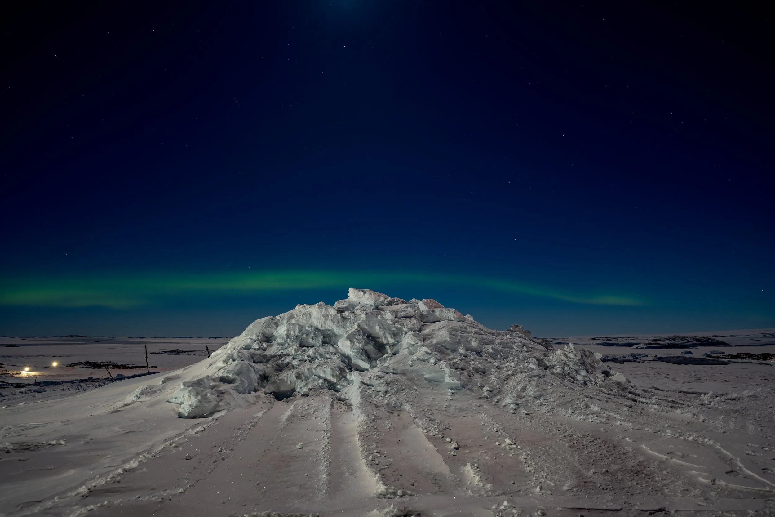 C315 - 13th of June - Aurora to the north during a near full moon, illuminating the snow in the foreground