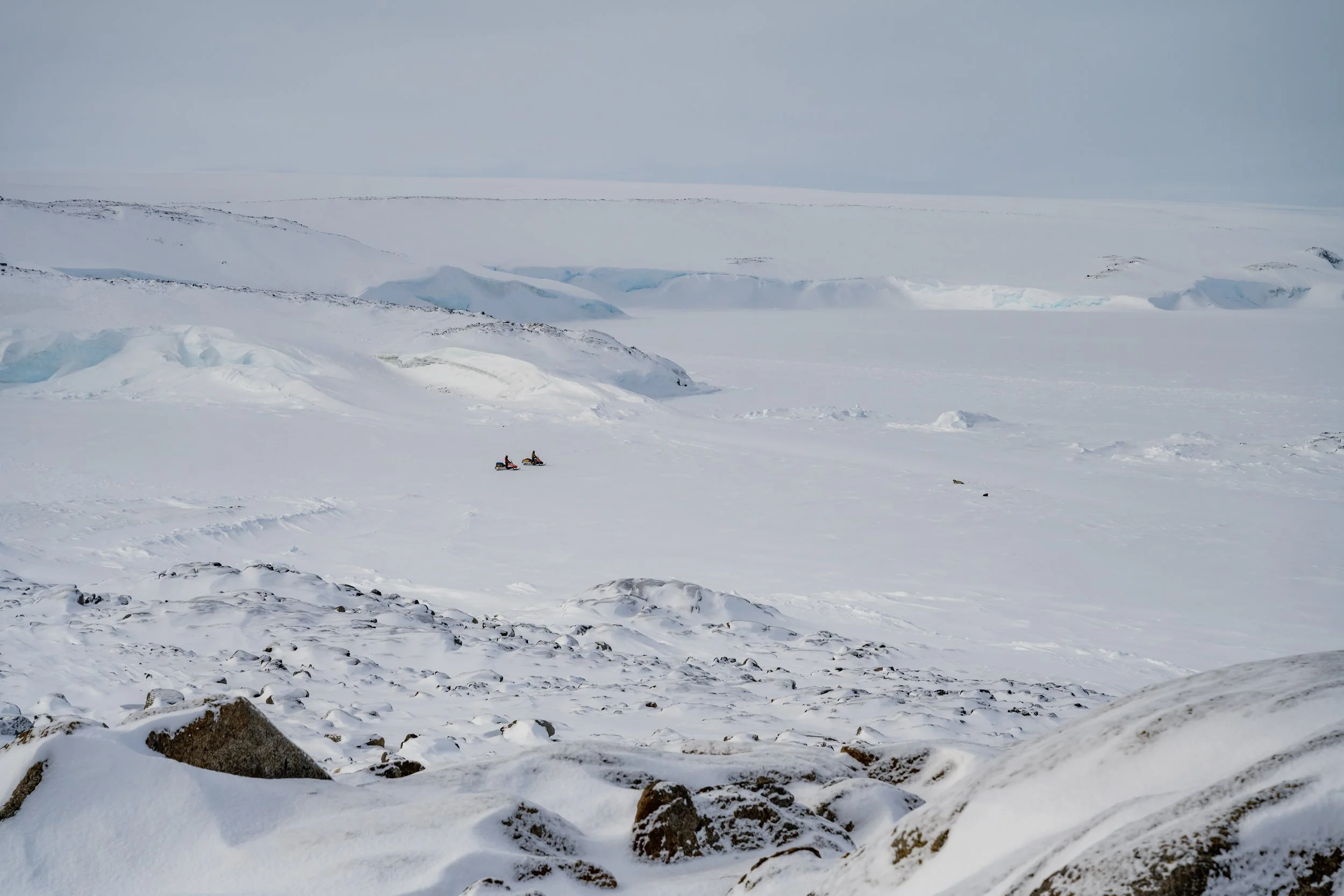 C508 - 22nd of September 1:02 pm - The FTO and a expeditioner driving skidoos across Penney Bay - taken from Odbert Island