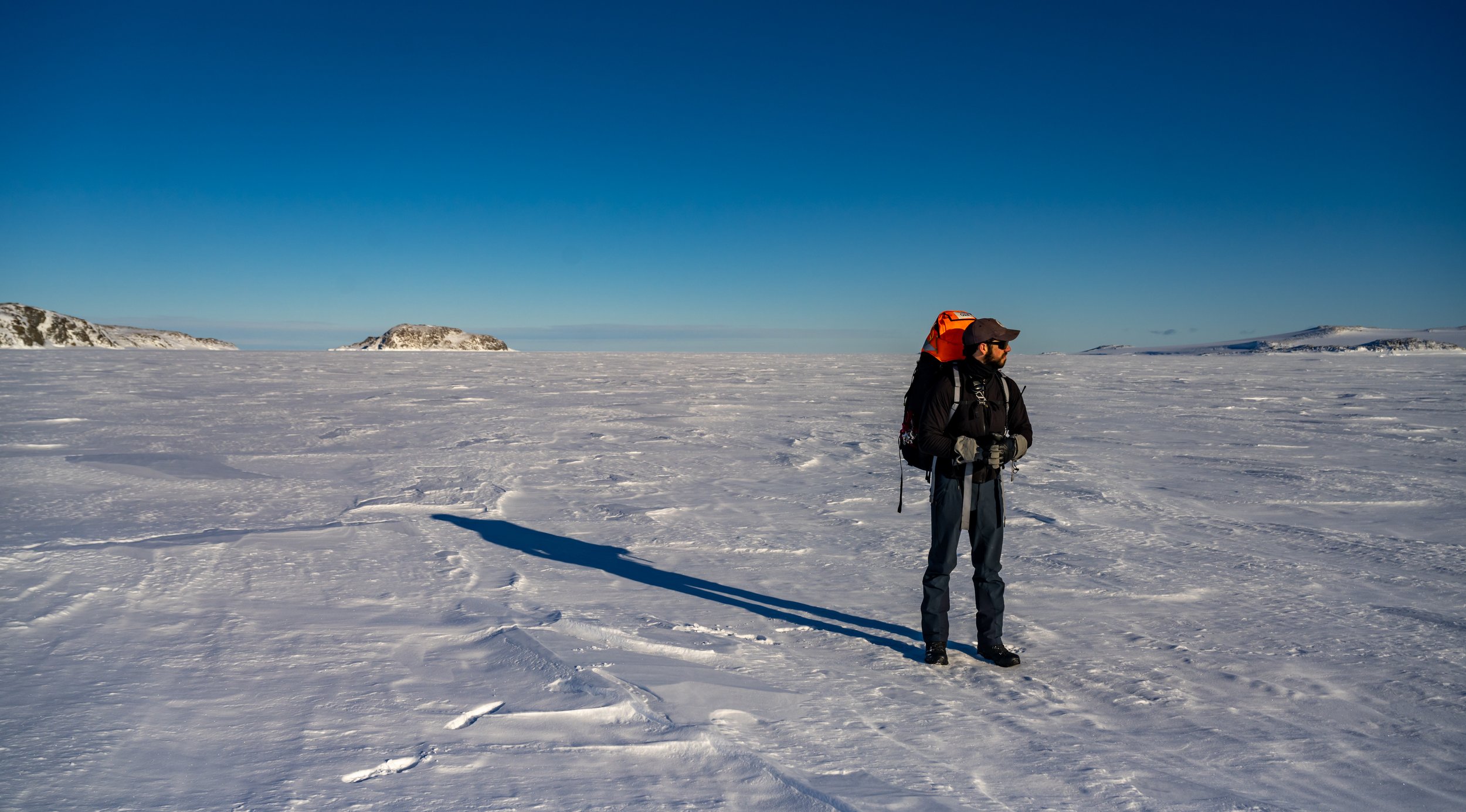 C509 - 27th of September 8:53 am - FTO Flynn walking across the sea ice in Sparkes Bay, heading to Casey Station