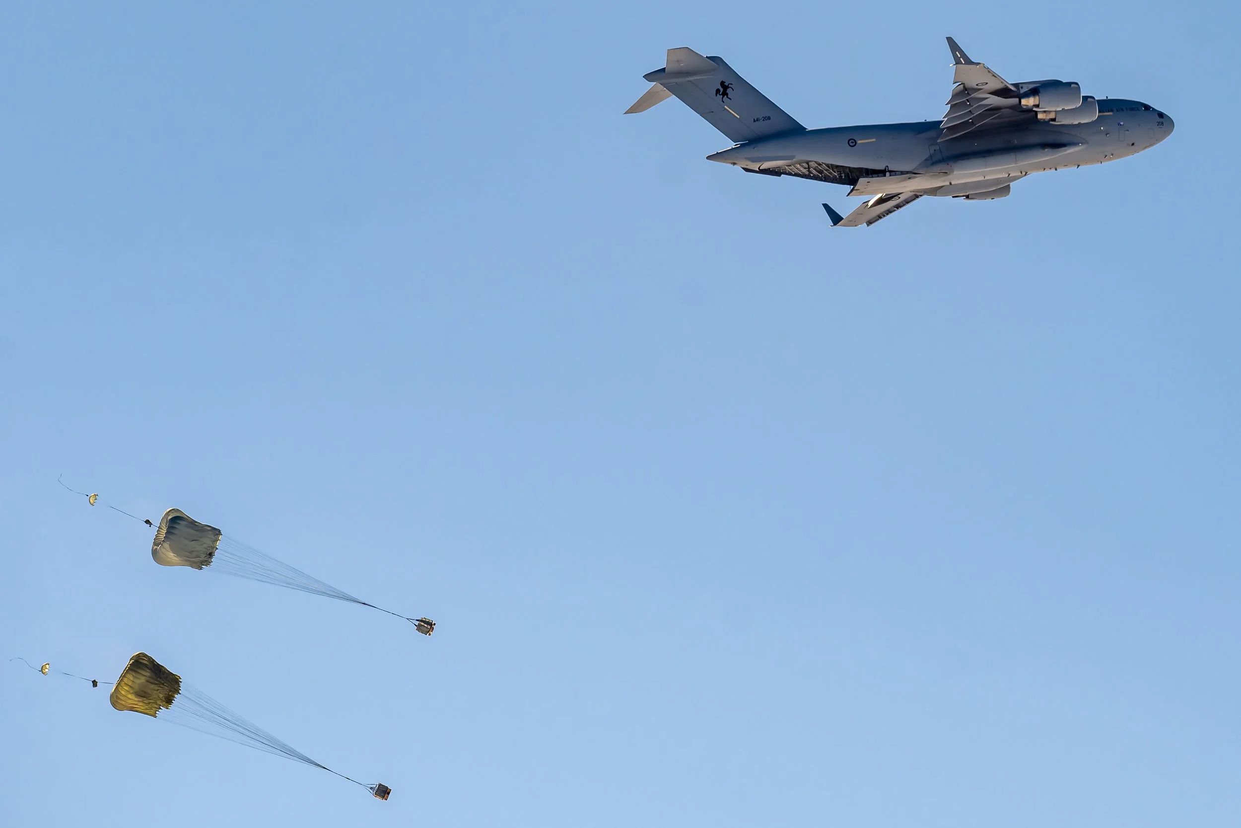 C604 - 4th of October 11:45 am - The RAAF C17 A Globemaster III releasing two Pallets from the back of the aircraft