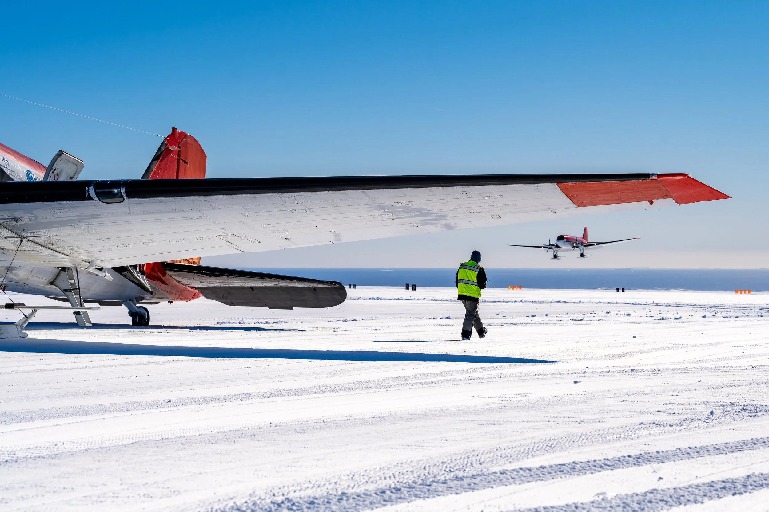 C643 - 12th of November 2022 7:47 pm - Ken Borek Basler C-GJKB (Aus) at Casey Skiway with C-FMKB (USA) just about to land after both flew from McMurdo Station