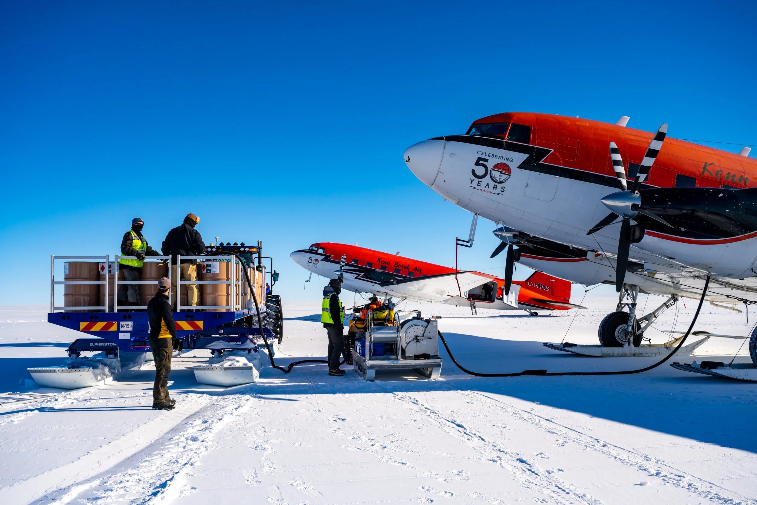 C644 - 12th of November 2022 7:47 pm - Ken Borek Basler C-GJKB (Aus) with C-FMKB (USA) being refuelled at Casey Skiway after both arrived from McMurdo Station