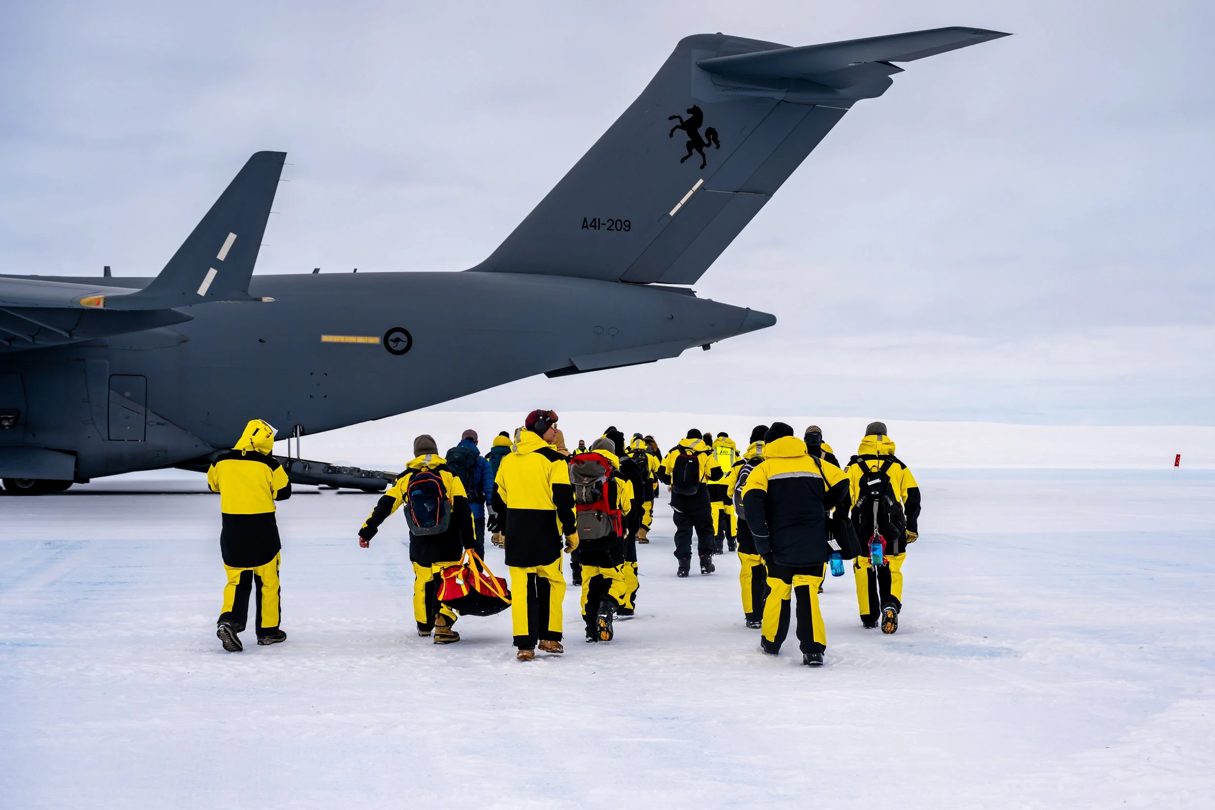C656 - 26th of November 2022 12:46 pm - ANARE 75 departure day - Most of the outgoing winter crew boarding the RAAF C17A Globemaster at Wilkins runway
