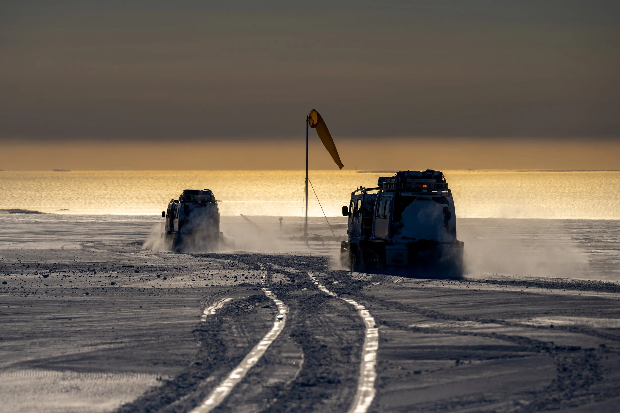 C661 - 12th of November 2022 9:19 pm - Two Hägglunds depart Casey Skiway passengers that arrived in the Baslers from McMurdo Station