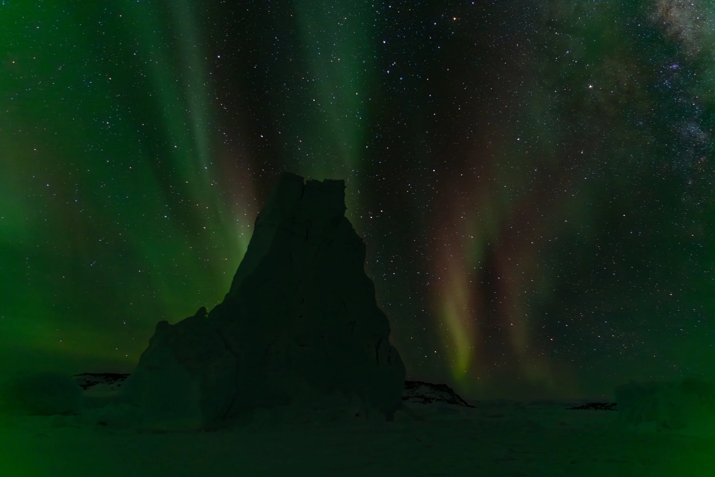 AA 019 - Davis Aurora 17th of June 2017 9:46 pm, iceberg silhouette near 'Bandits Hut'  - Nikon D750, 24mm, f/2.8, ISO 100, exp 20sec