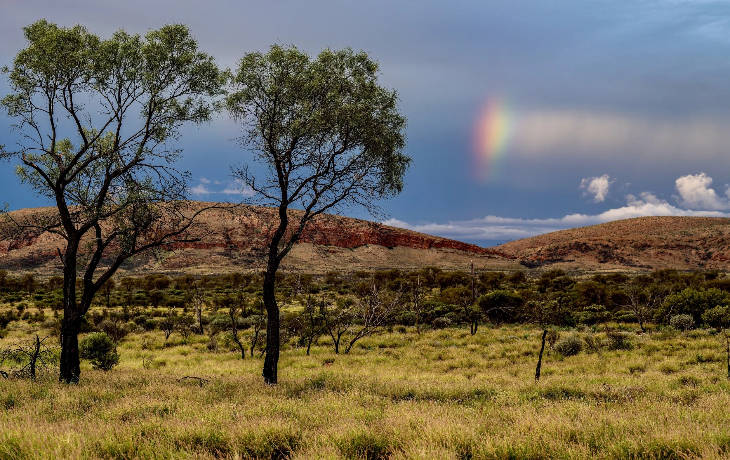 G014- 10th of December 2024 18:56 - Rainbow and darkening sky to the north of Purli Yurliya (Rawlinson Ranges).