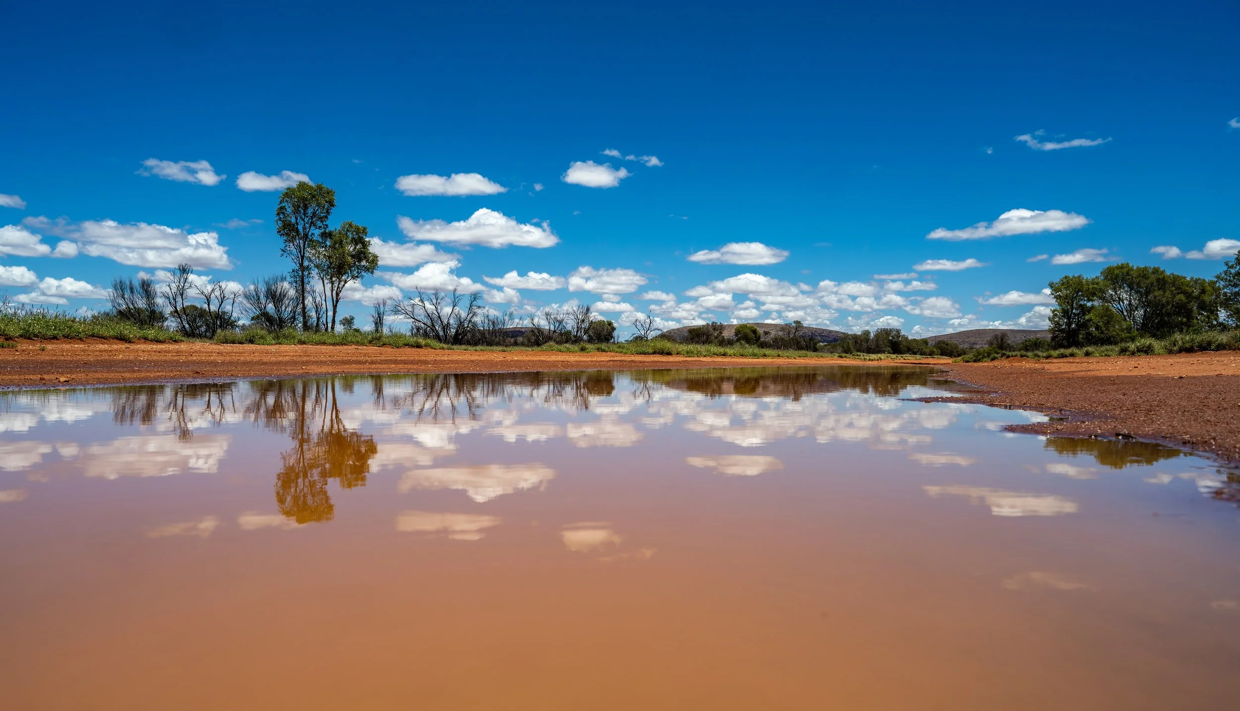 G023- 26th of November 2024 12:01 - After the rain - reflection in a puddle on the track to the Air strip