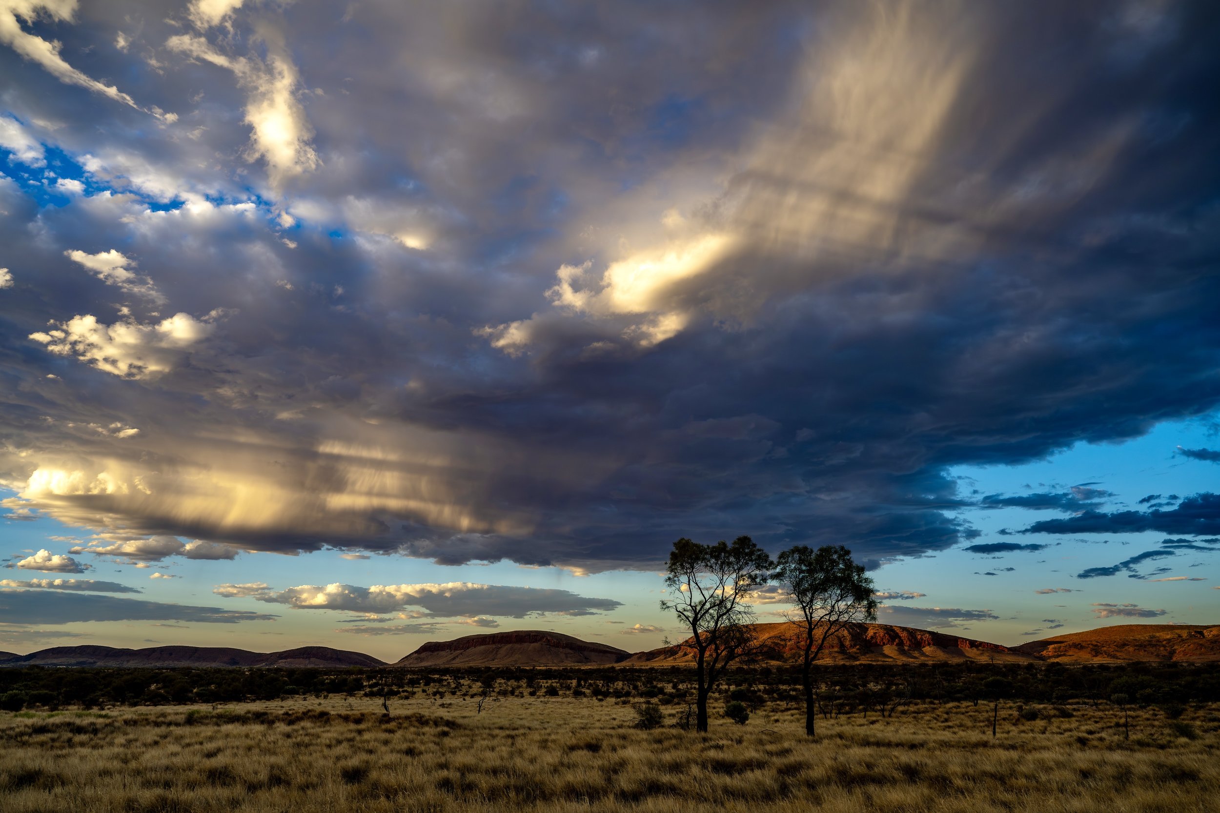 G117 - 4th of February  2025 17:55 - Developing storms at sunset over Purli Yurliya (Rawlinson Ranges).