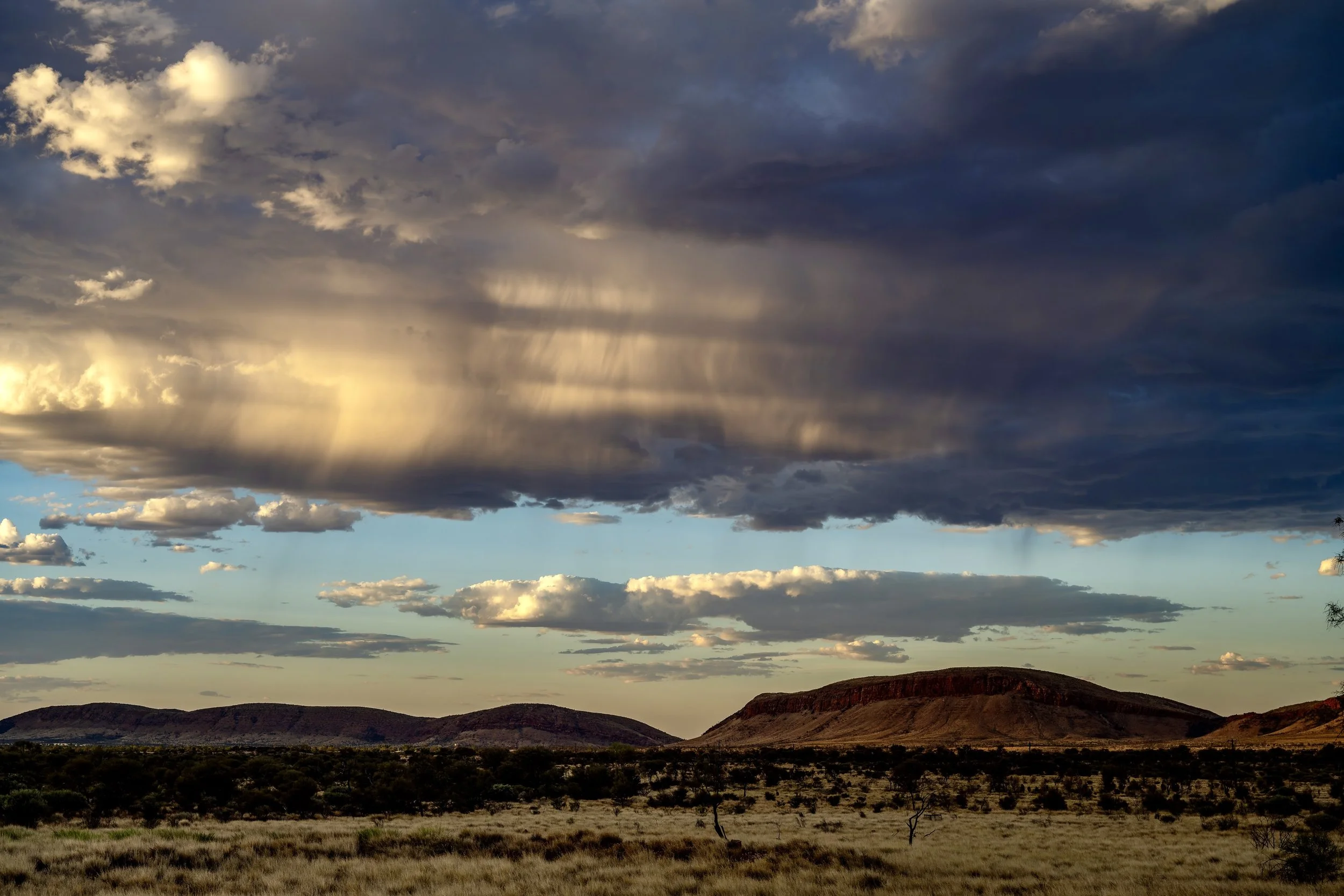 G142 - 4th of February  2025 17:56 - Striated cloud from developing storms at sunset over Purli Yurliya (Rawlinson Ranges).