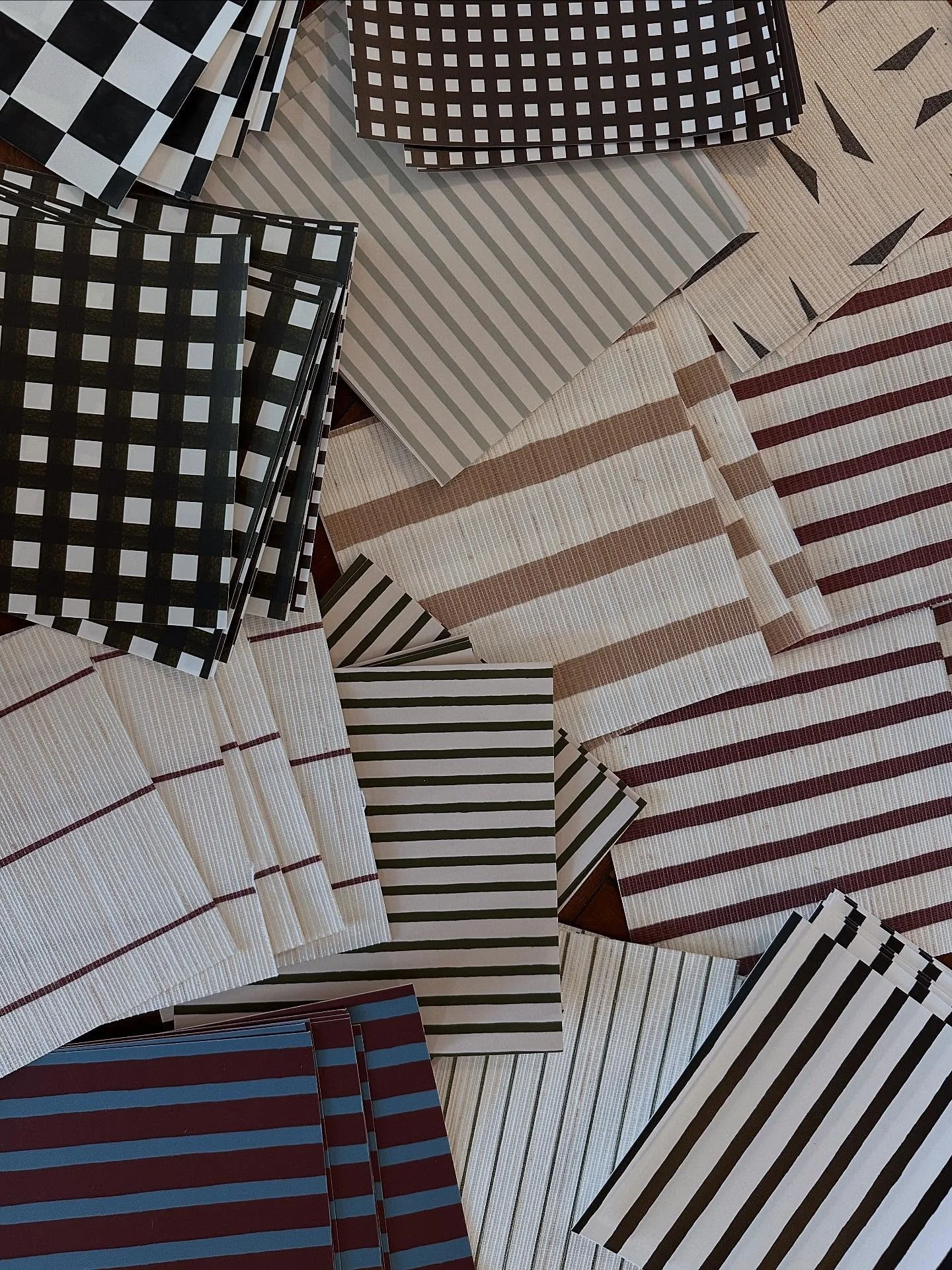 All colours of our hand-painted stripes and checks have just arrived into the studio on wallpapers and grasscloths 🤍 project samples heading out to our international showrooms soon! Custom colours available 🌈