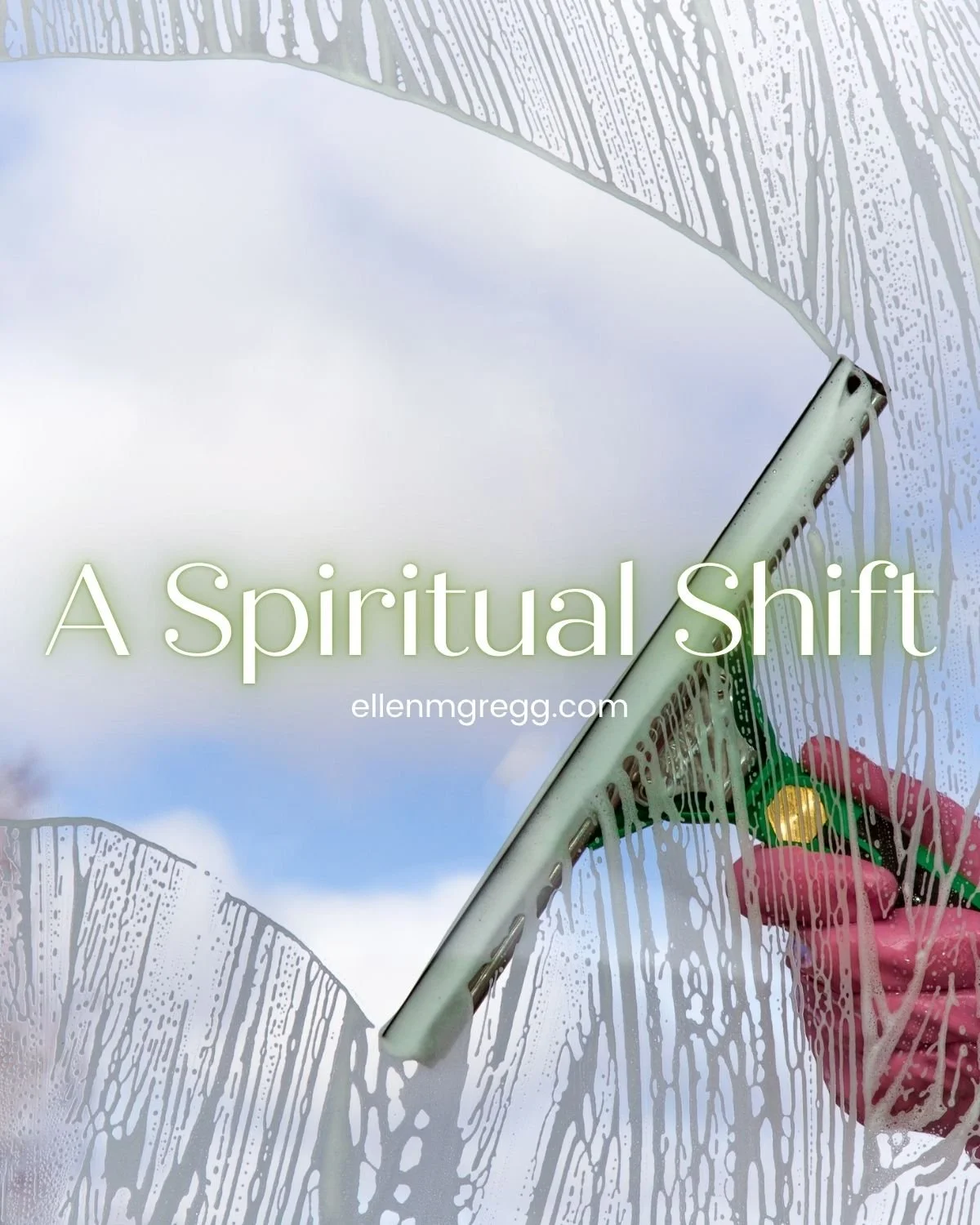 A squeegee reveals clear glass beyond the window cleaner.