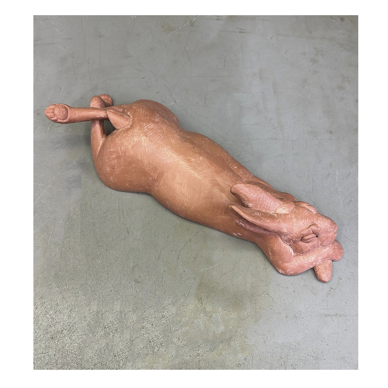 joshua-tobey-bronze-sculpture-rabbit-bunny-laying-on-belly-top-view.png