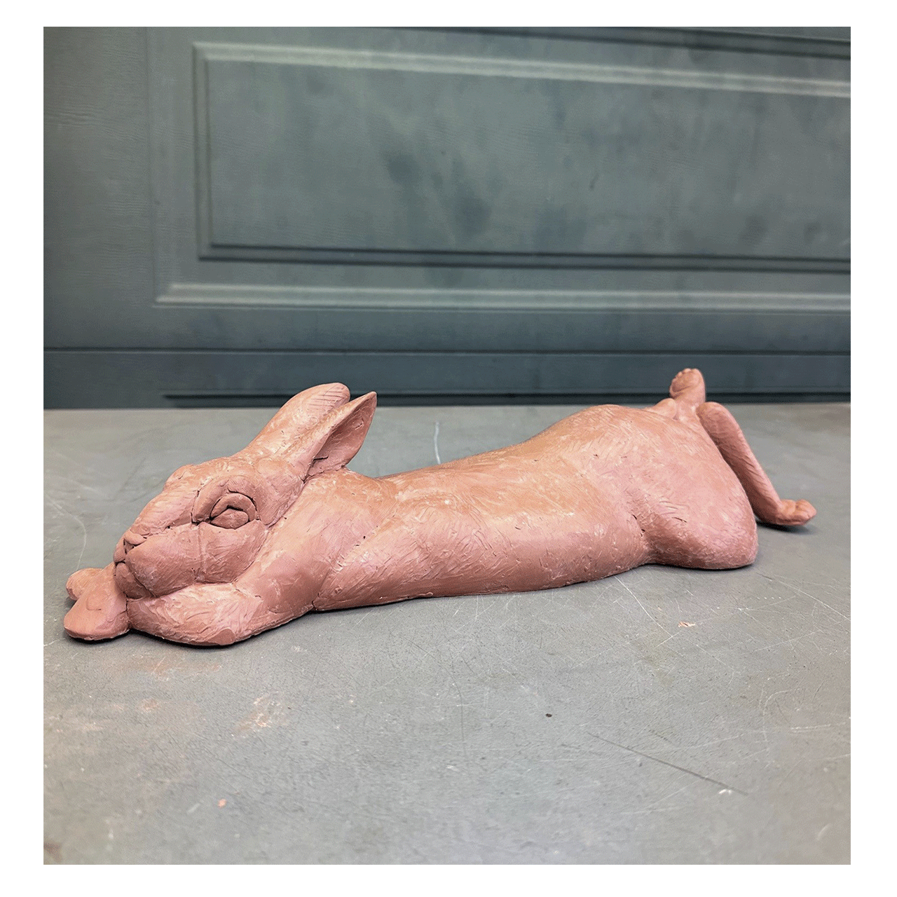 joshua-tobey-bronze-sculpture-rabbit-bunny-laying-on-belly-side-view.png