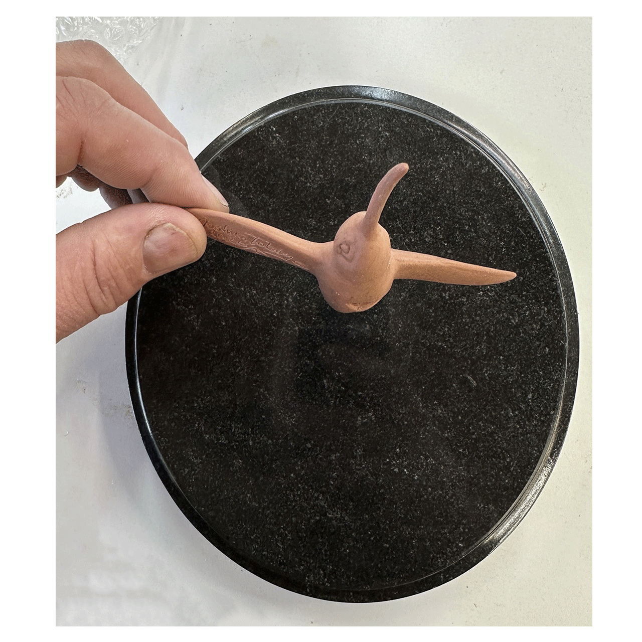 joshua-tobey-bronze-sculpture-hummingbird-precast-on-black-up.png