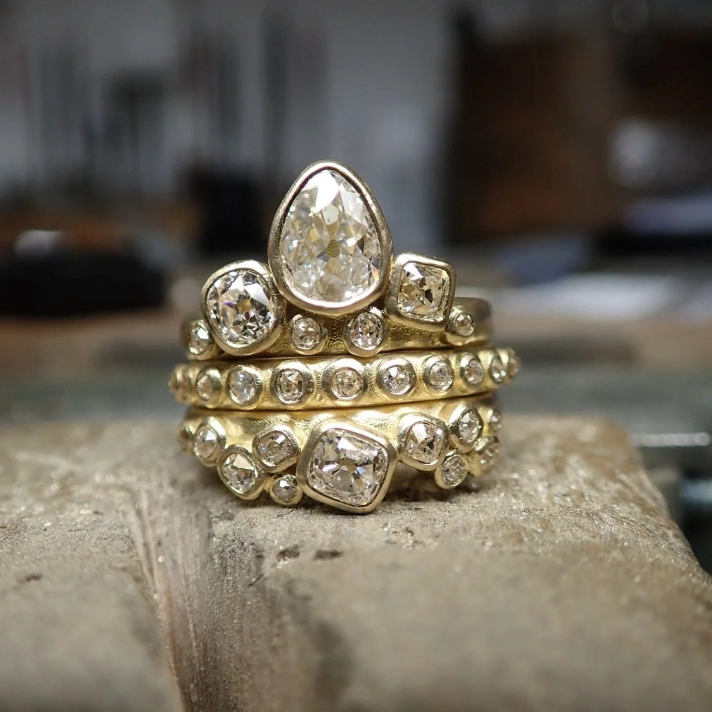 A show-stopping treasure trove of rings.

This stack features diamonds in all different shapes and sizes, each one with its own character. I love how the warm gold organically wraps around each stone as if they&rsquo;ve just been unearthed.

I think 