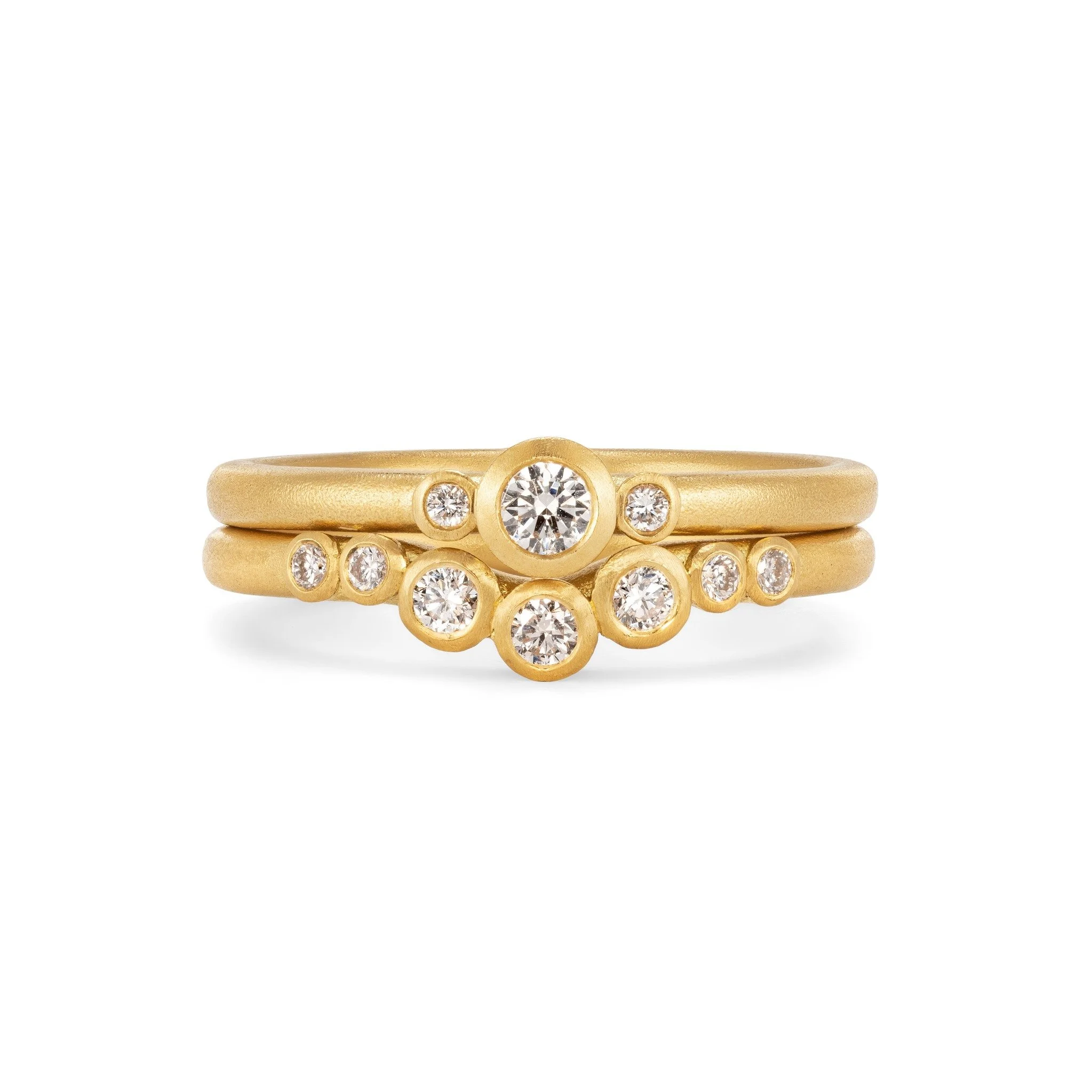 curved-diamond-eternity-ring-stacked-with-triple-mini-solitaire-ring-18ct-yellow-gold-mirri-damer.jpg