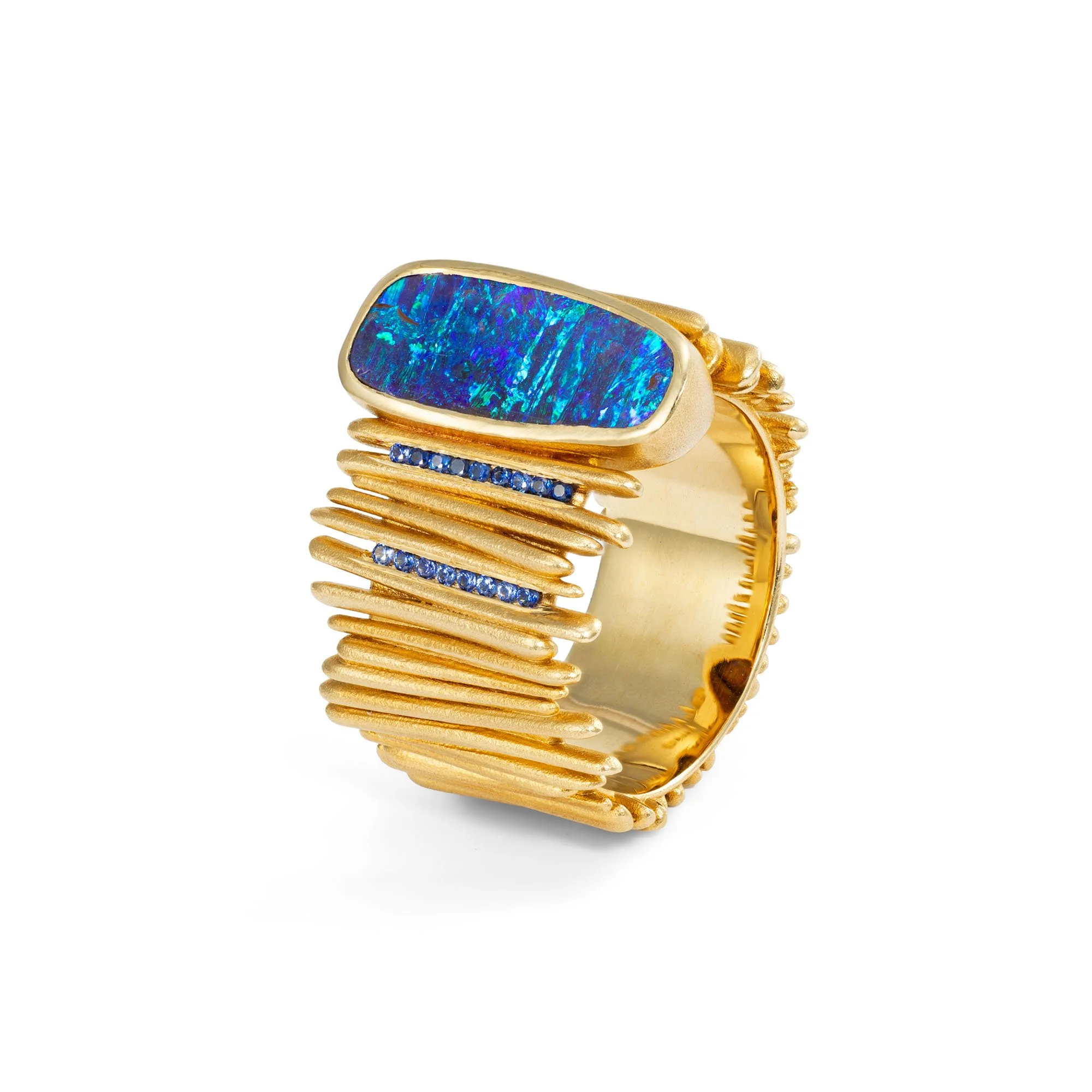Side view of Mirri Damer's gold Drift ring showing the raised setting of the Australian opal and layered gold detailing.
