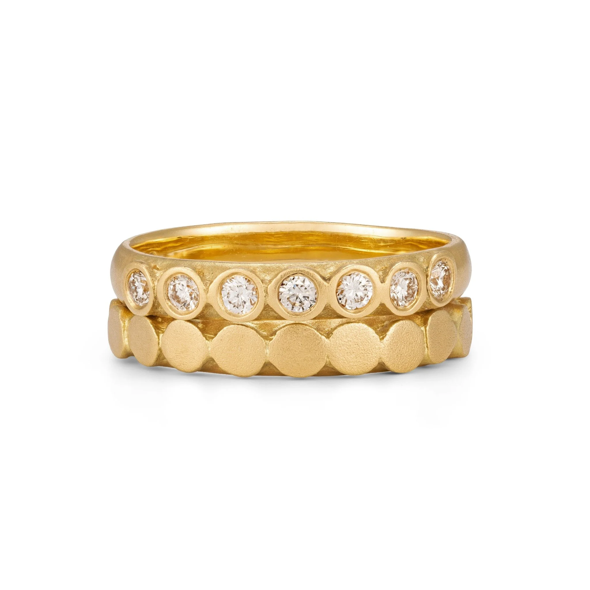 18ct yellow gold Dot Ring stacked beneath a seven stone diamond eternity ring