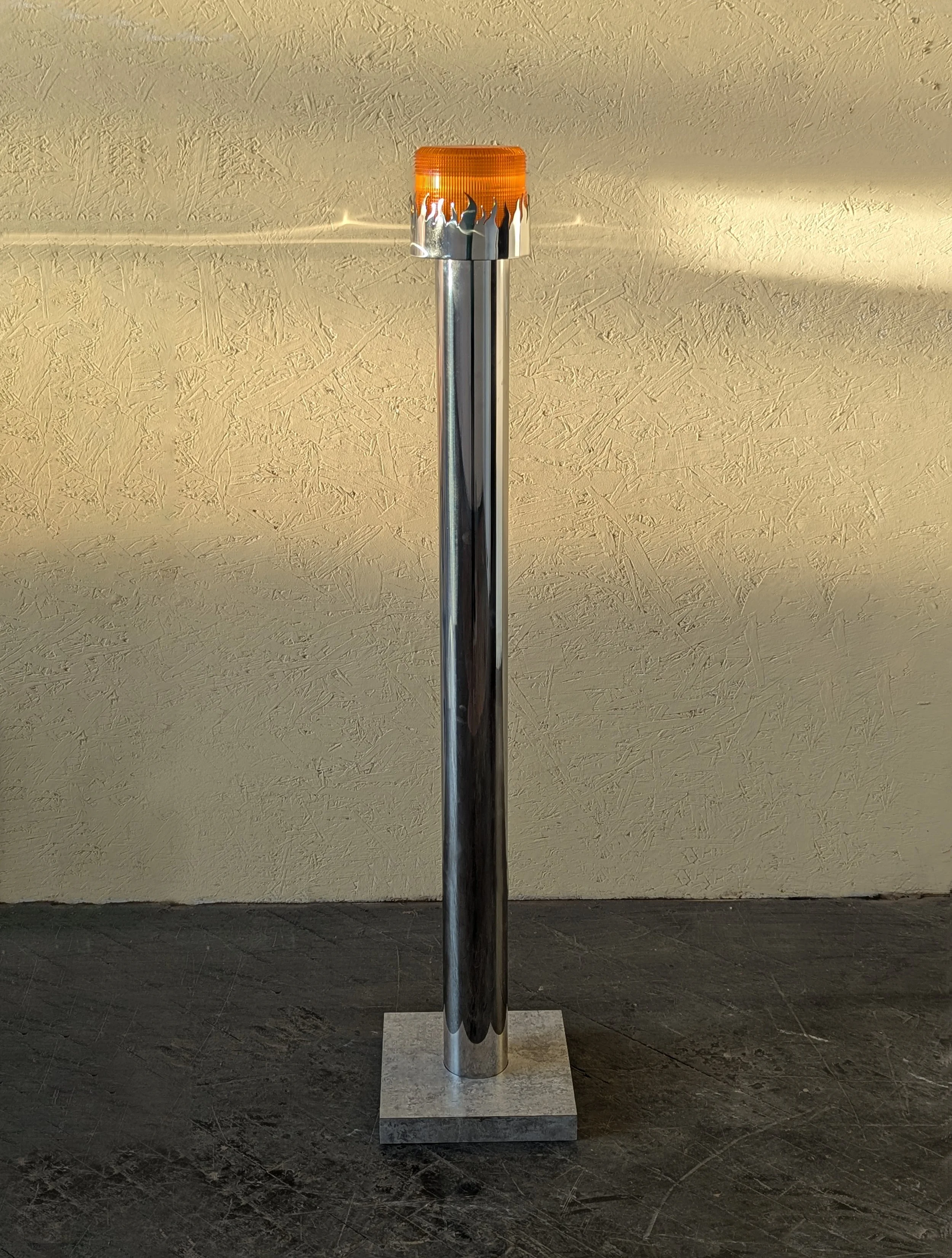   CARL DURKOW    Eternal Flame Of Construction   Stainless Steel, polycarbonite shade, laminate  58 x 14 x 14 inches   $1,900  