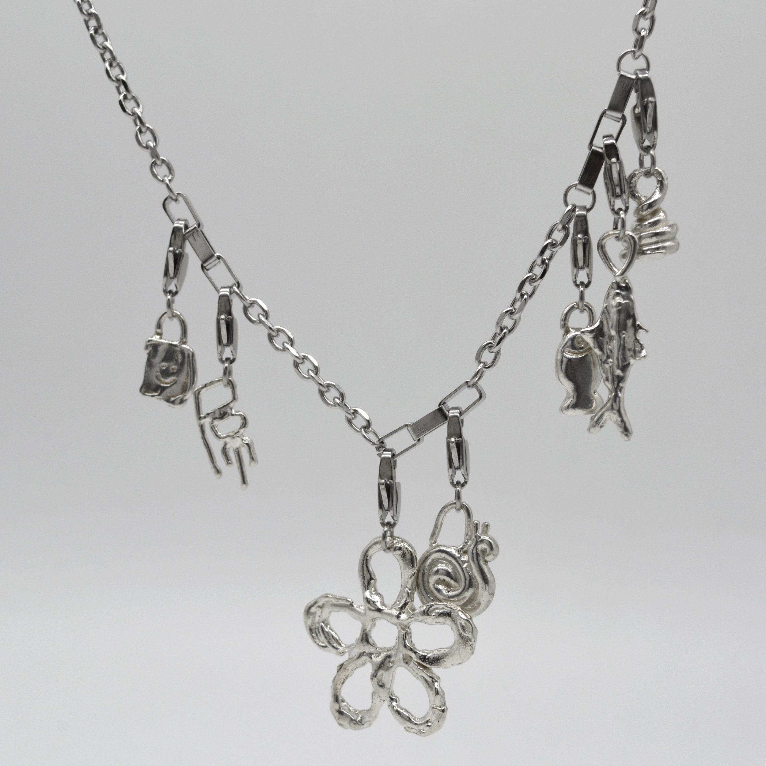 SILVER CHARM NECKLACE SQUARE.jpg