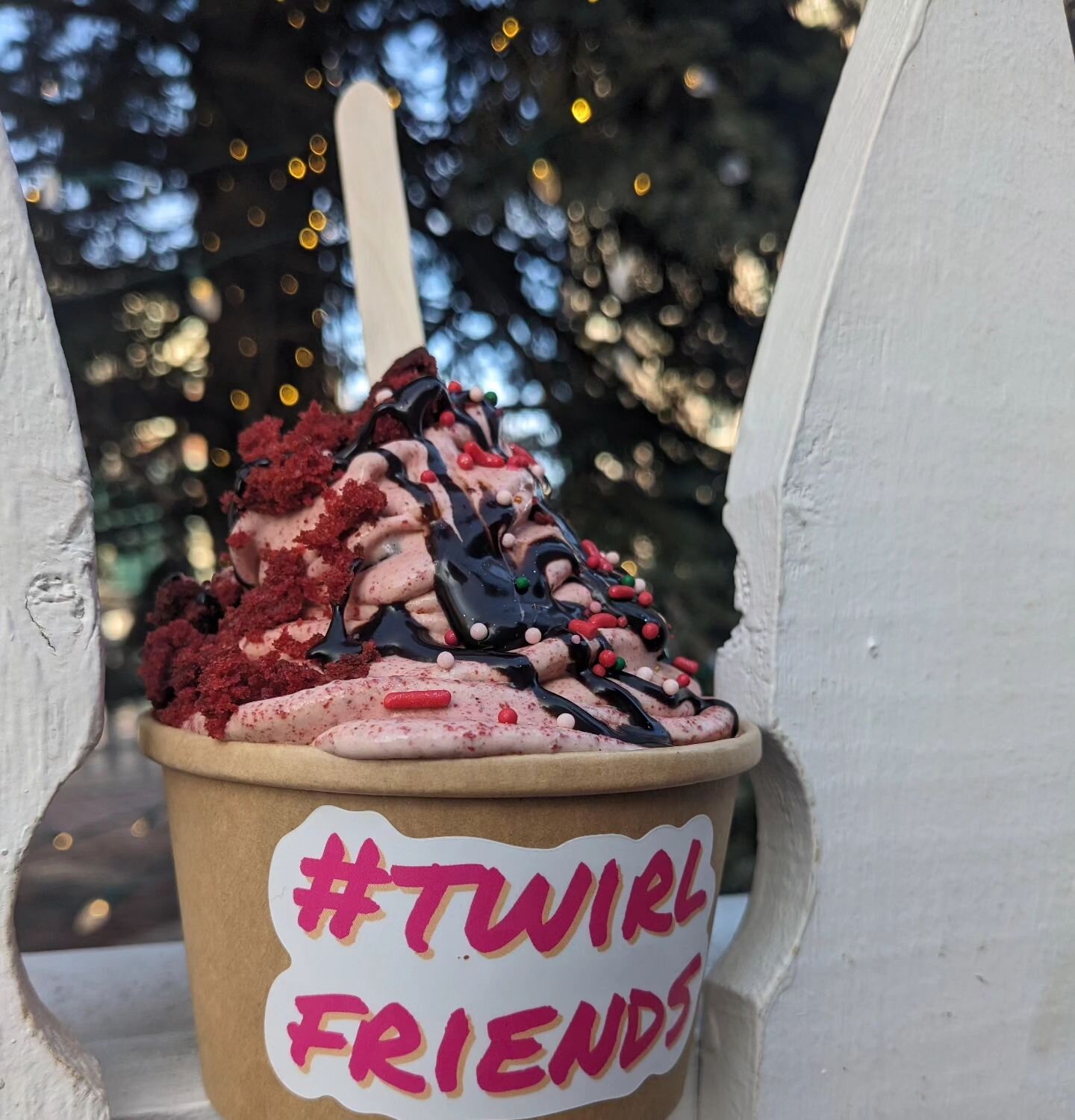 Crimson and Clover! 

This cutie is giving 
chocolate covered orange 
X
cake and ice cream:

Red velvet cake twirled with ground cloves and orange
into vanilla ice cream,
plus chocolate drizzle and a few sprinks to tie it all together!

We are kickin