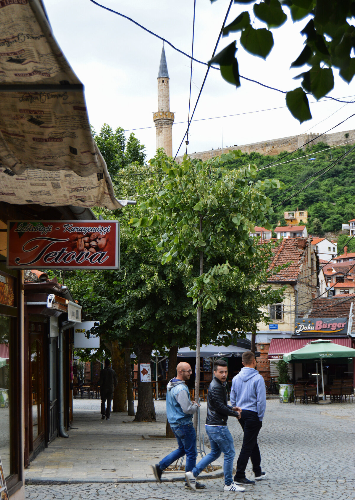 Young men in Prizren walk towards one of the Ottoman-era mosques.