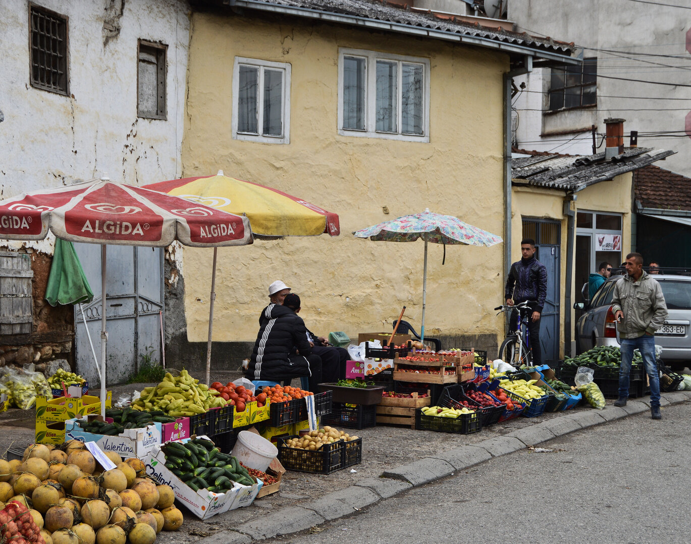 Fruit and vegetable vendors outside Prizren’s city center discuss the recent elections.