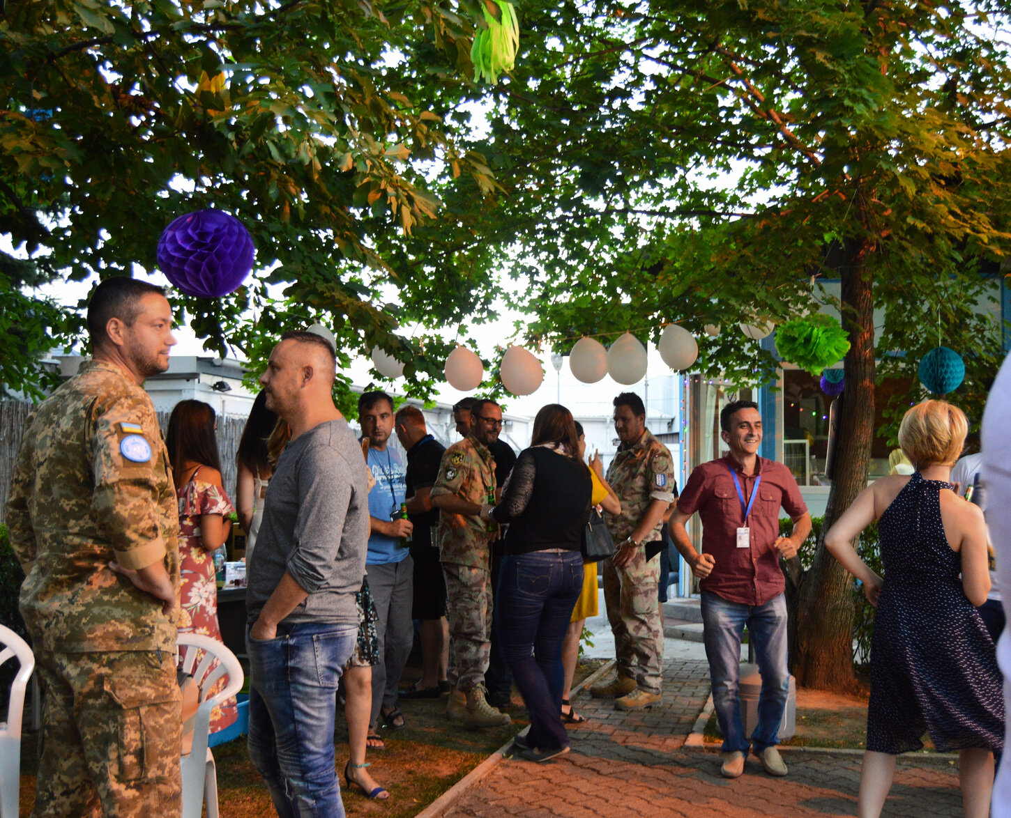 U.N. peacekeepers and mission staff dance at a midsummer’s garden party in the lawn of the U.N. compound in South Mitrovica.