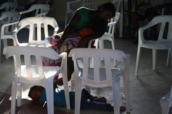 An Embera woman and her two children rest inside the church during the UN-led event in June 2015. 